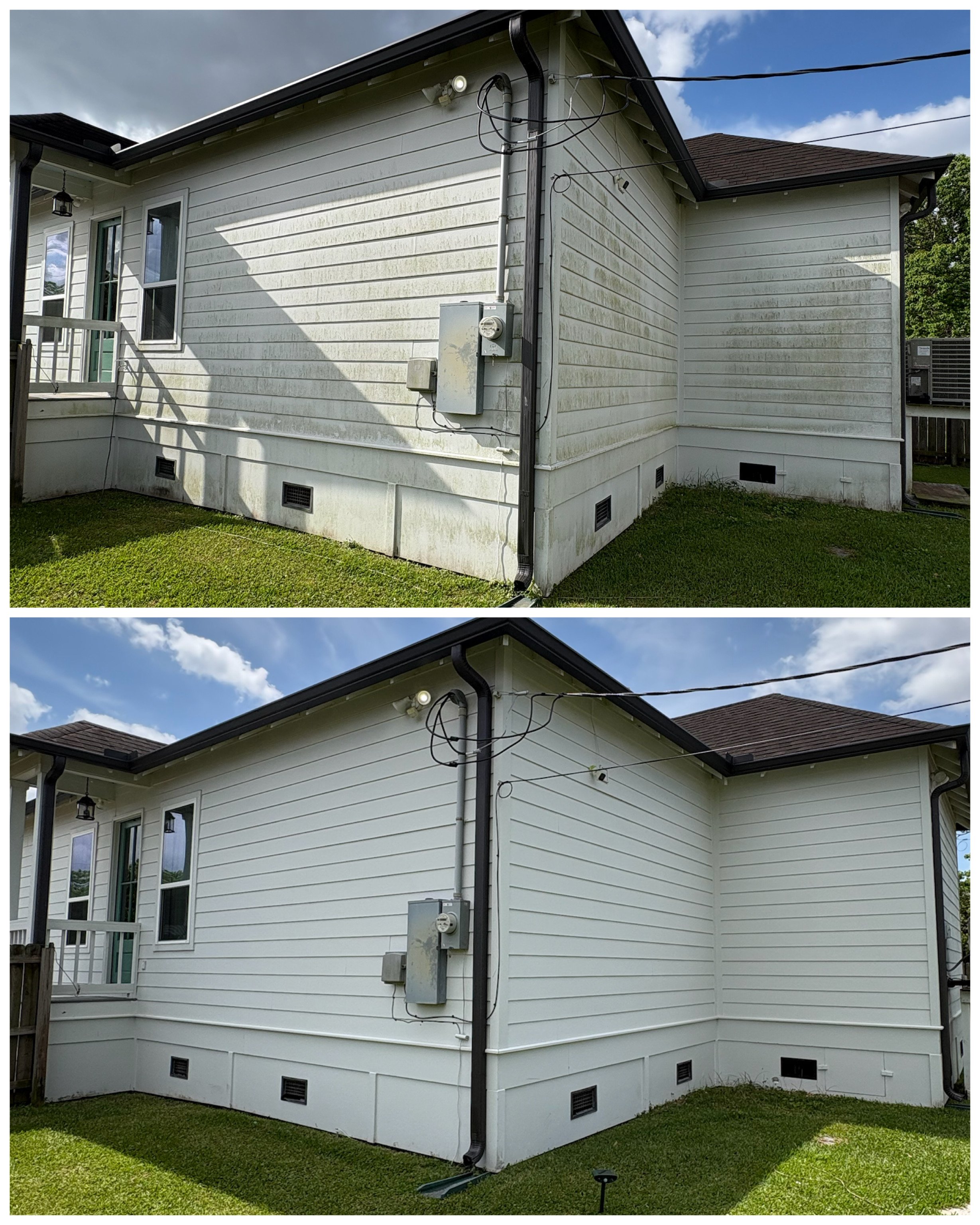 Before and after soft wash, Side view of a white house with vinyl siding, black trim, windows, and a small porch, showing electrical wires and boxes on the exterior wall, with a grassy yard and a partly cloudy sky.