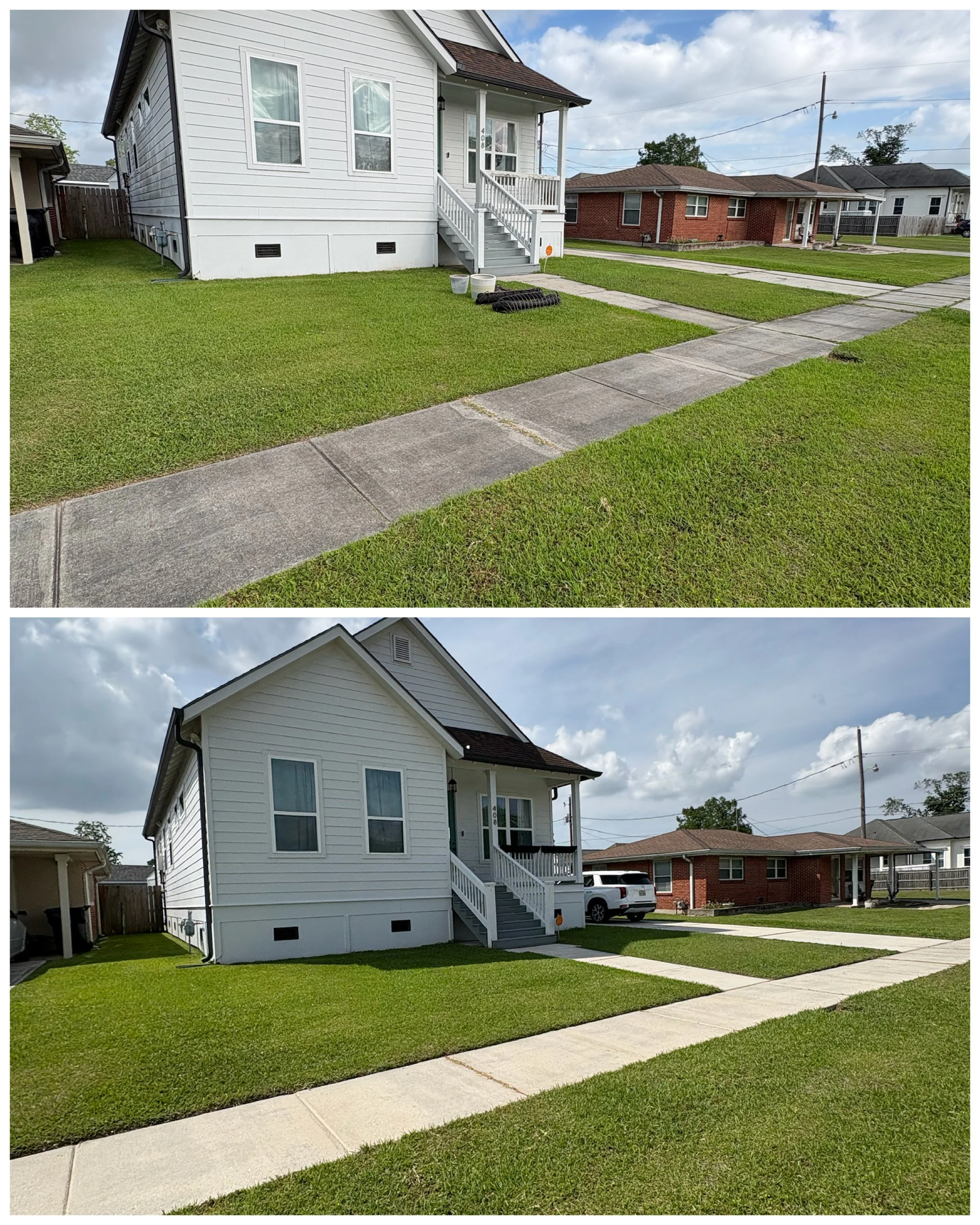 A two-story white house with a front porch and staircase, situated in a residential neighborhood with neighboring houses, a well-kept lawn, before and after pressure washing of concrete walkways, and a partly cloudy sky.
