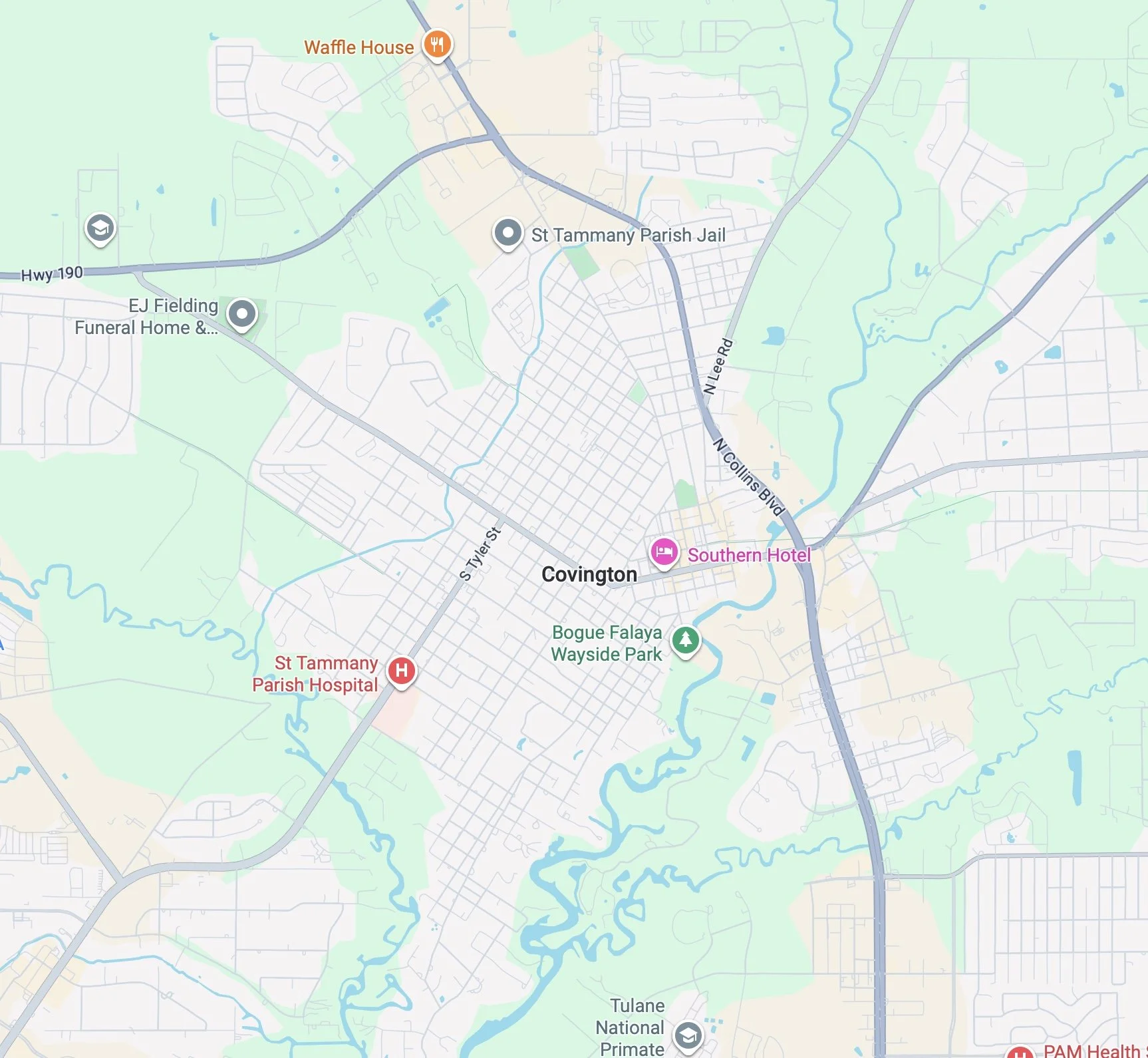 Map of Covington, Louisiana showing streets, rivers, and landmarks including St. Tammany Parish Jail, Southern Hotel, Covington, and nearby parks and hospitals.