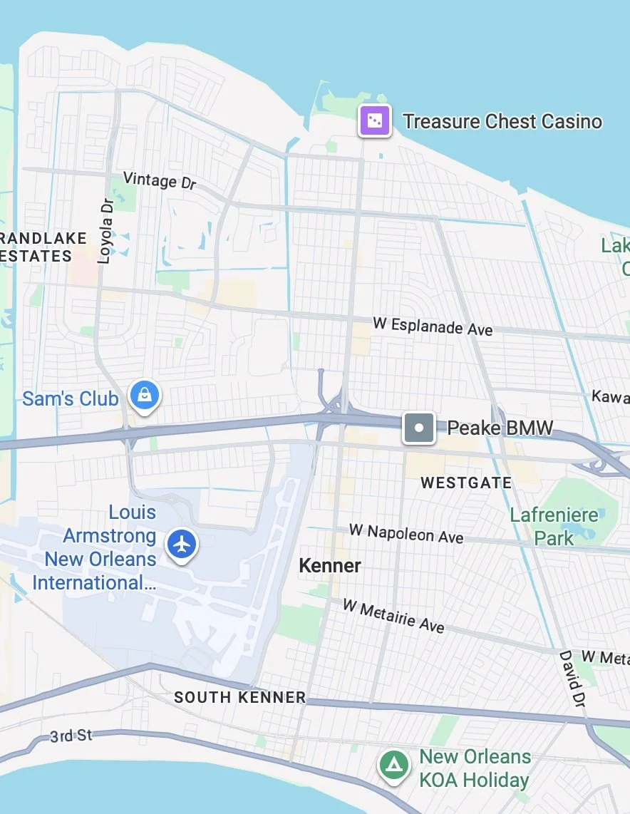 Map of an area in New Orleans, showing landmarks such as Louis Armstrong New Orleans International Airport, Sam's Club, Treasure Chest Casino, Peake BMW, Lafreniere Park, and New Orleans KOA Holiday. Streets include Vintage Dr, W Esplanade Ave, W Napoleon Ave, and South Kenner.