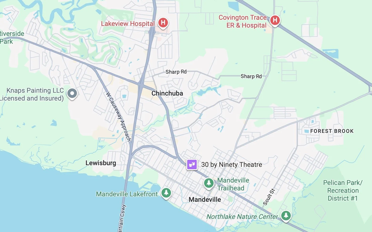 A map of Mandeville, Louisiana showing streets, parks, and landmarks including Lakeview Hospital, Covington Trace ER & Hospital, Mandeville Lakefront, Trailhead, Northlake Nature Center, and Forest Brook.