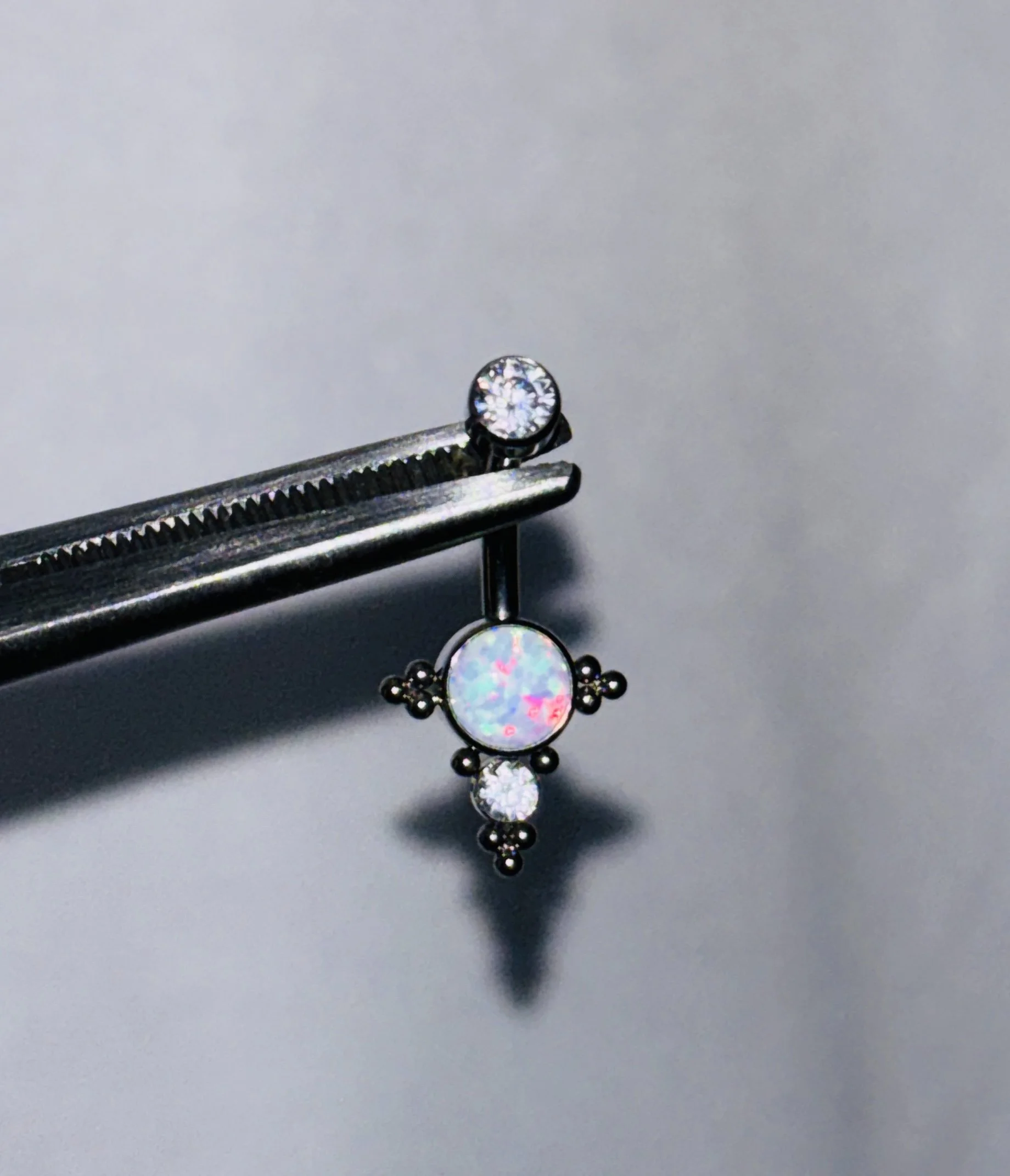 White opal titanium triple jeweled navel jewelry upgrade