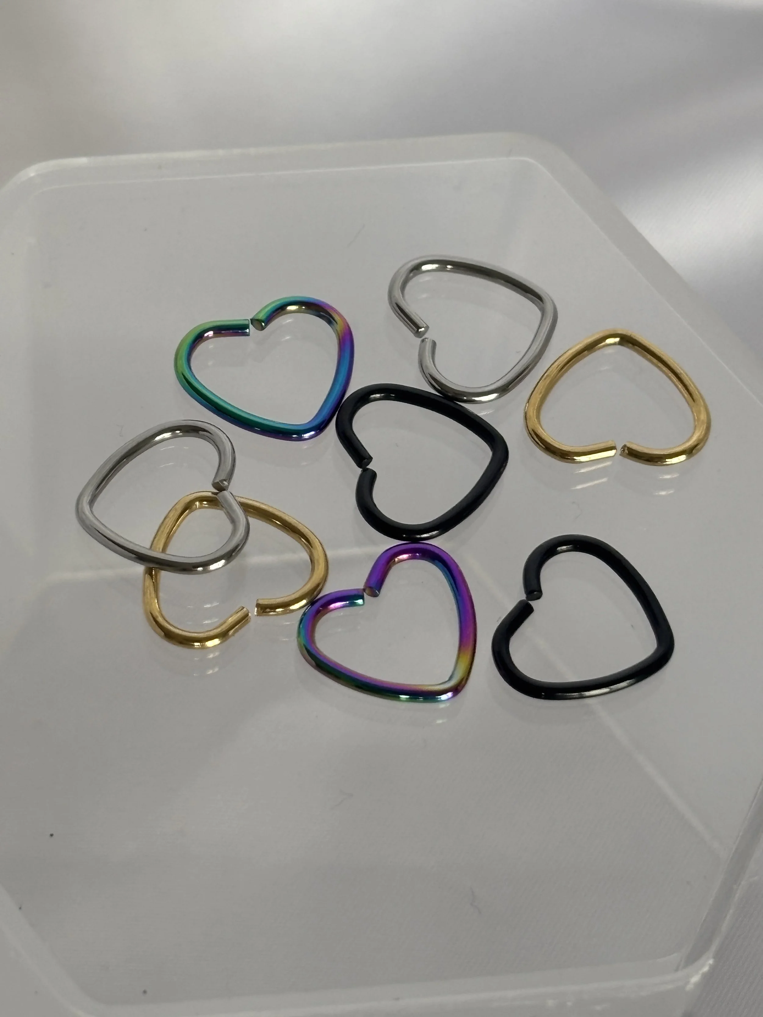16 g titanium segment heart shaped ring (Gold, black, silver, oil slick) (Daith, helix)