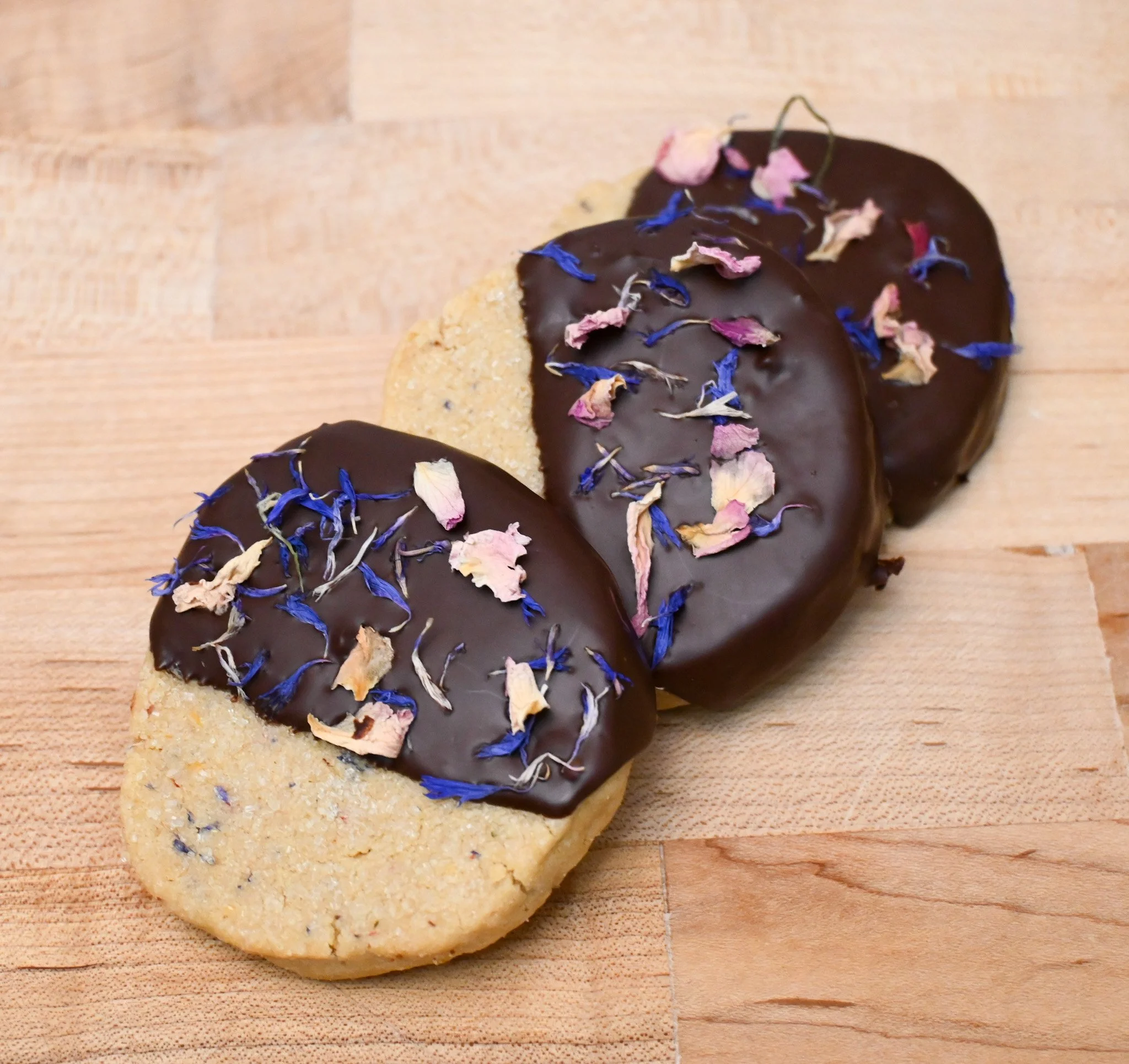 Chocolate coated "Flowerfetti" shortbread cookie made with Sonora Wheat flour.