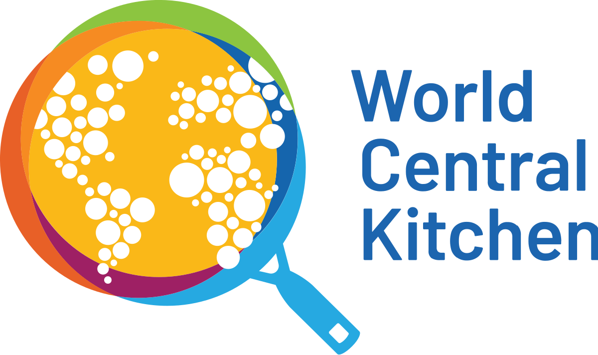 Colorful logo of a globe made of overlapping circles in orange, yellow, purple, green, and blue, propped on a blue magnifying glass, with the words 'World Central Kitchen' to the right.