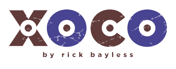 Logo with the words 'Xoco by Rick Bayless' in stylized font.