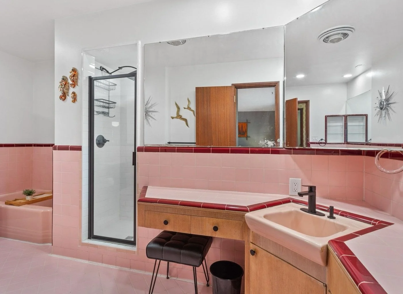 This 1950s Mid Century Modern style daylight ranch is absolutely stunning ✨ So many fun original details mixed with some era appropriate updates. I&rsquo;m loving the colorful tile work in the kitchen and primary bath 💜 

4 bed | 2 bath | 3202 sqft
