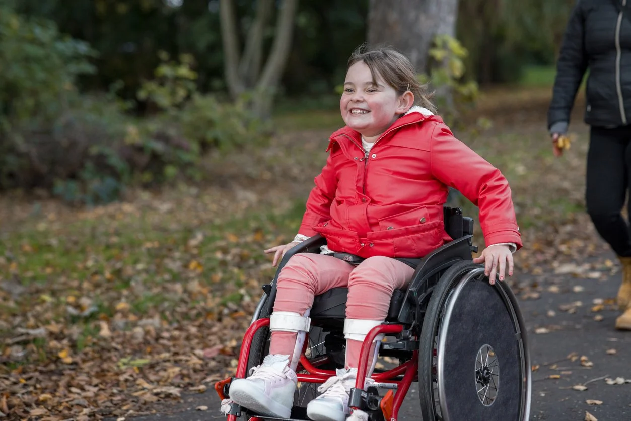 Mobility Aids - girl with red in wheelchair Stock-1382221091.jpg