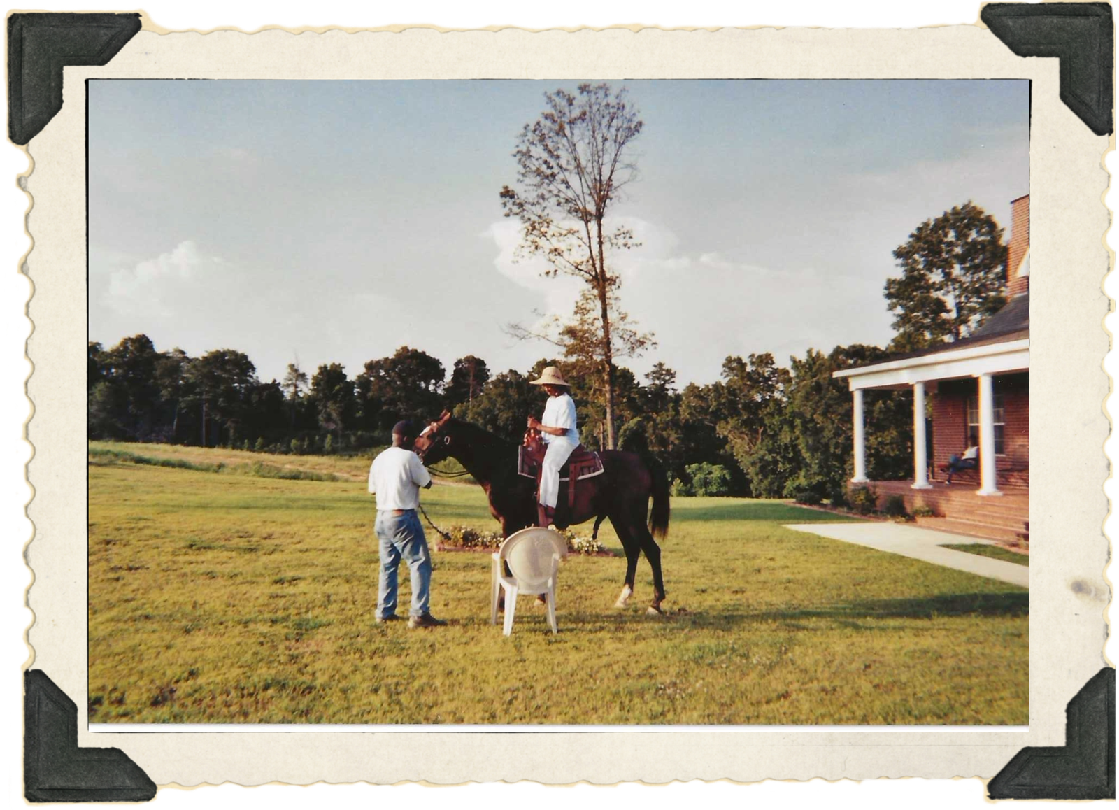 In profile, Wilma, dressed in baby blue pants and shirt and straw hat, sits atop Margarita, a brown horse.