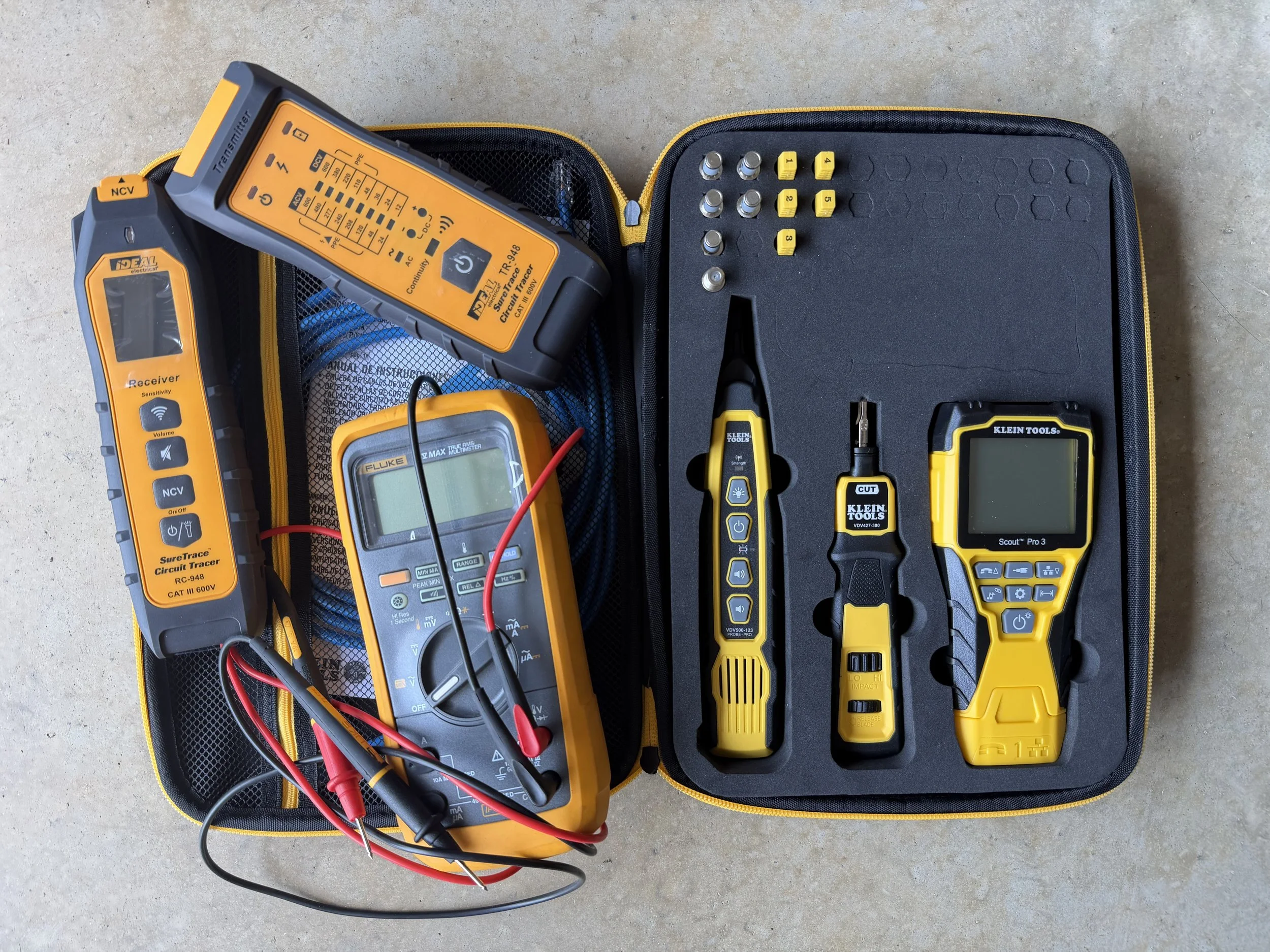 Industrial electrician using a digital multimeter for rapid fault diagnostics and preventative maintenance on commercial switchgear.
