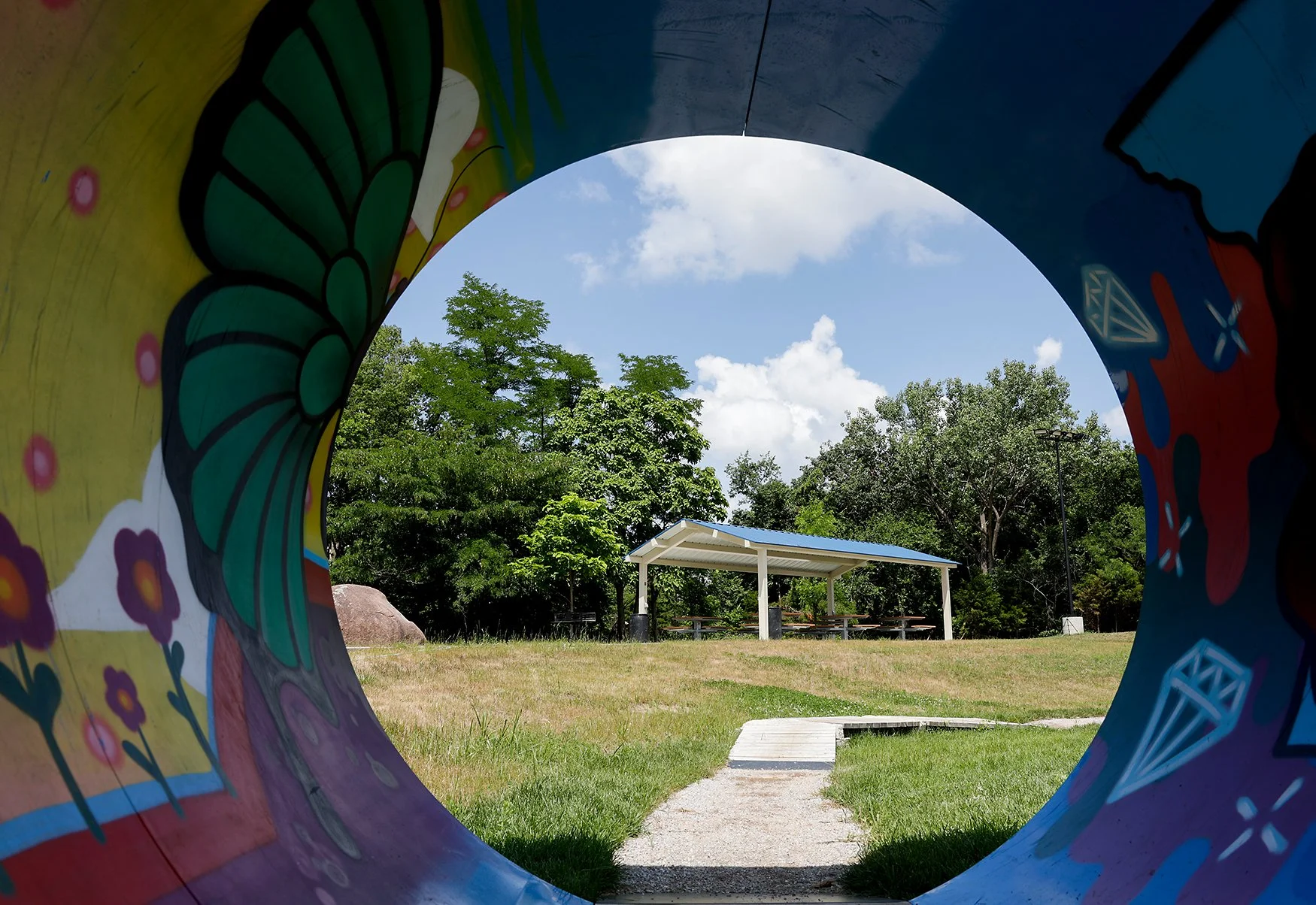 A colorful tunnel frames a pavilion in Cosmo Park in Columbia's Second Ward. Cosmo Park contains the city’s largest playground system.