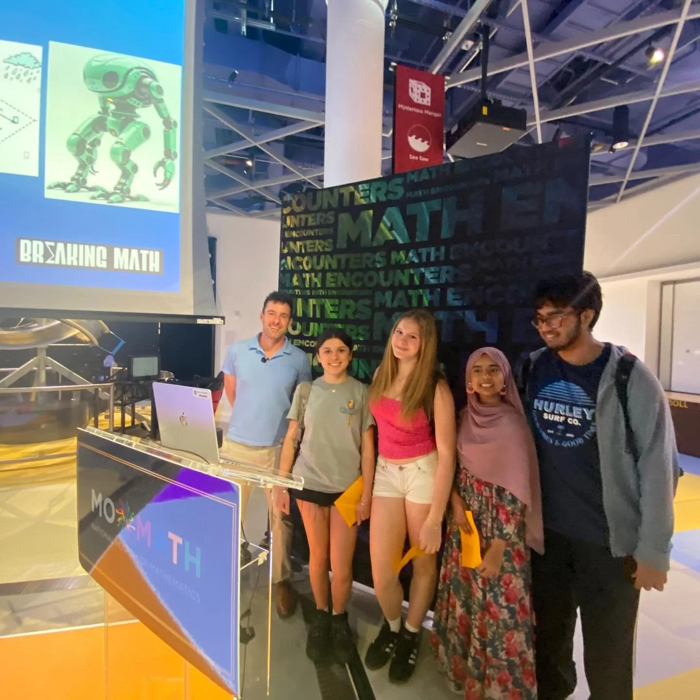 📐 Stepping into the Math at MoMath! 🏛️✨

Our students recently attended a fascinating &ldquo;Math Encounters&rdquo; talk at the National Museum of Mathematics (@momath1), led by Dr. Noah Giansiracusa, co-host of the Breaking Math podcast! 🎙️🔢

Th