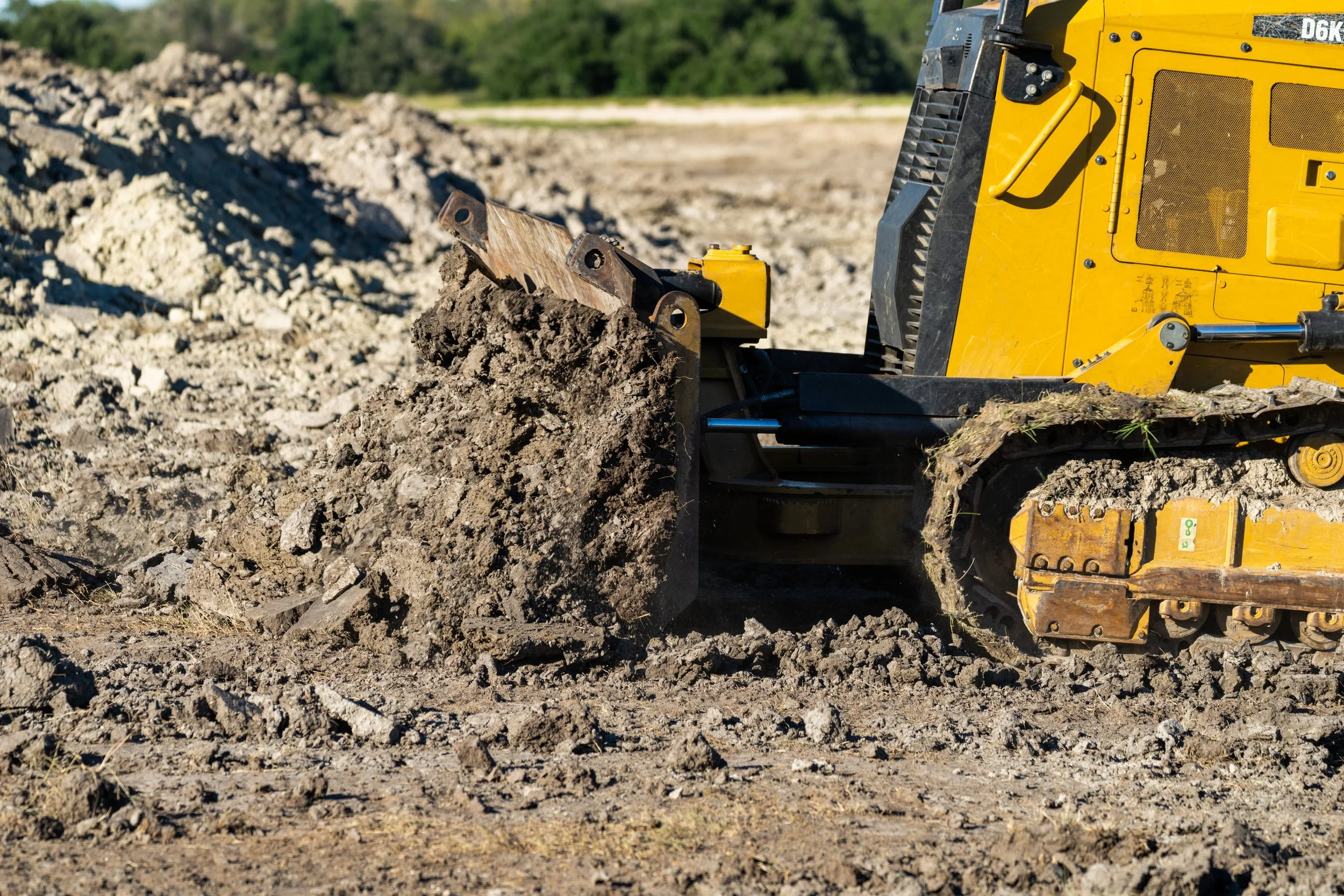Bulldozer moving dirt at a construction site