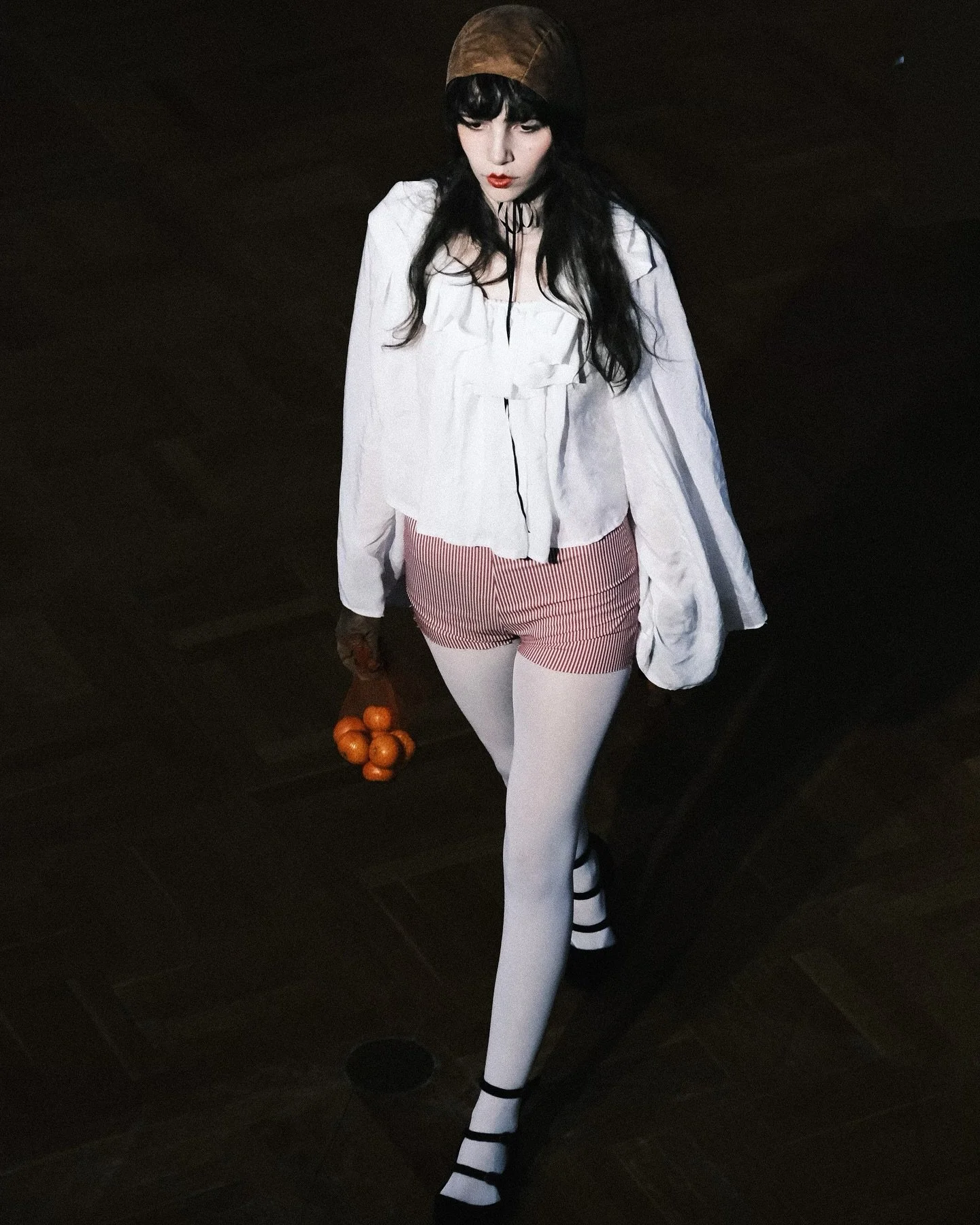 The Pierrot. The pining, yearning, heartbroken buffoon. Oranges are handed out as metaphor for the body: peeling skin back to break apart flesh and give away in little pieces. Oranges are meant to be shared. The body of The Pierrot is not her own. Sh
