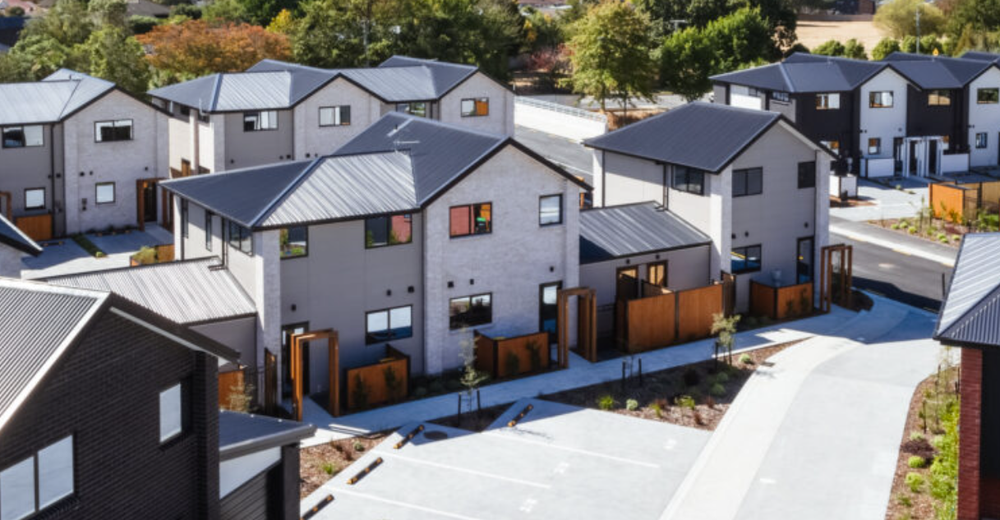 Architectural visualisation of townhouses arranged around landscaped outdoor spaces