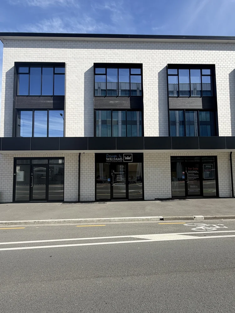 The white brick building housing Design by Williams on Colombo Street, Christchurch