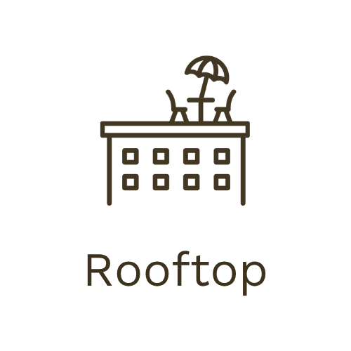 Minimalist icon of a rooftop with a table, chairs, and an umbrella, with the word 'Rooftop' underneath.