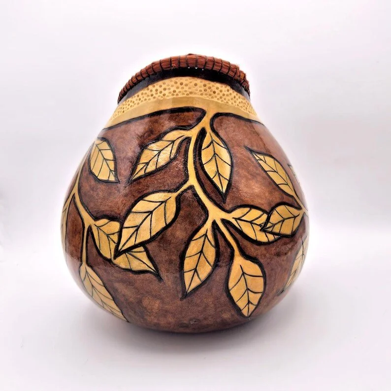 Rear view of decorative gourd bowl revealing seamless craftsmanship and rich, earthy tones of the natural material.