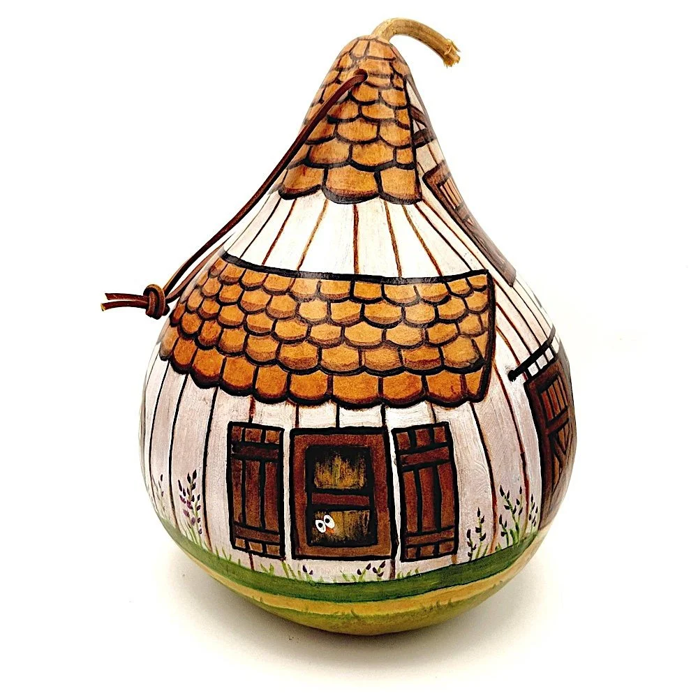 Side profile of the handcrafted White Barn Gourd Birdhouse, highlighting its curved shape and weather-resistant finish.