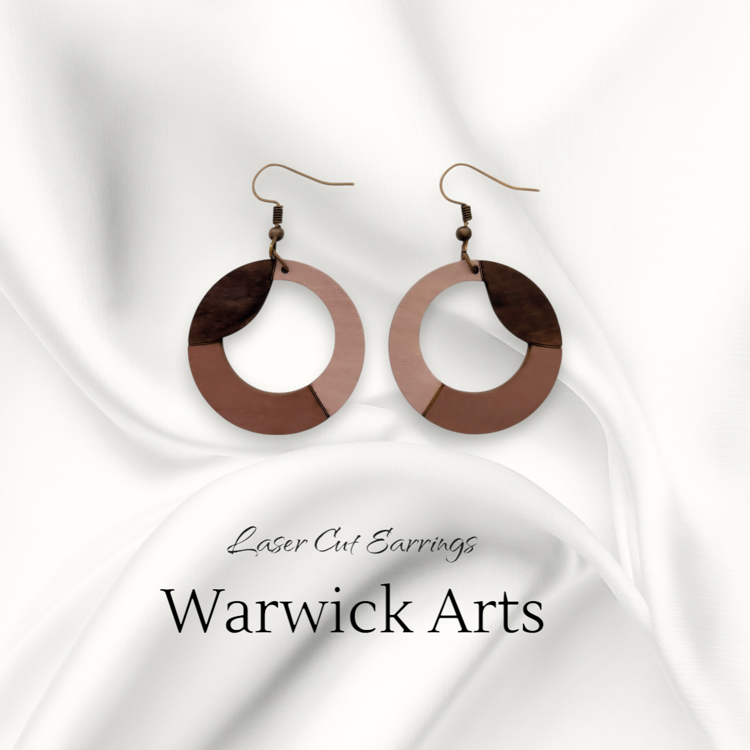 Laser-cut wood earrings in walnut, tan, and brown tones with subtle lavender undertones, featuring a modern circular wave design and copper ear wire.