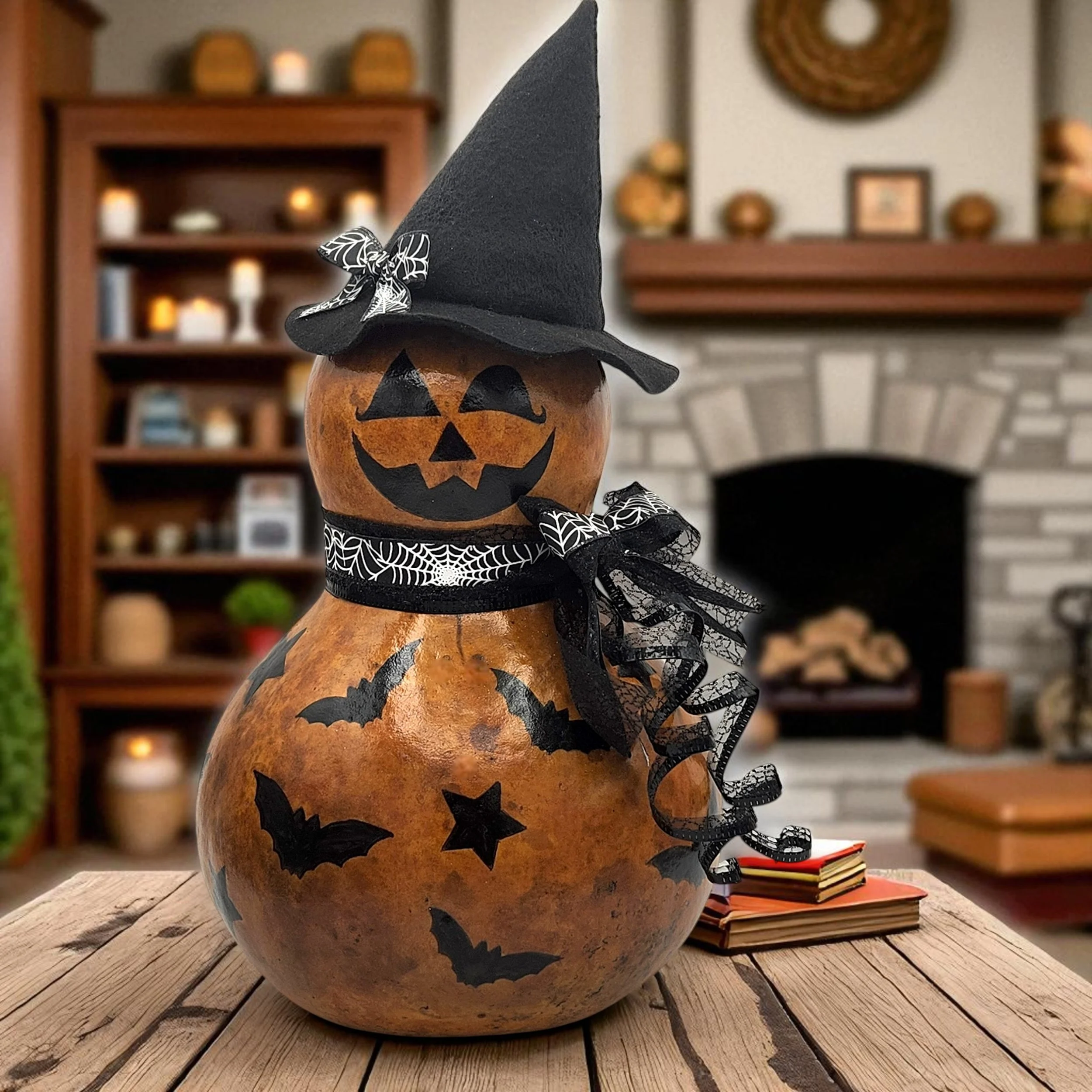 This 14" burnt orange bottle gourd features a cheerful jack-o'-lantern face, stenciled bats and stars, and a black witch hat with spiderweb bow—perfect for spooky season decorating.
