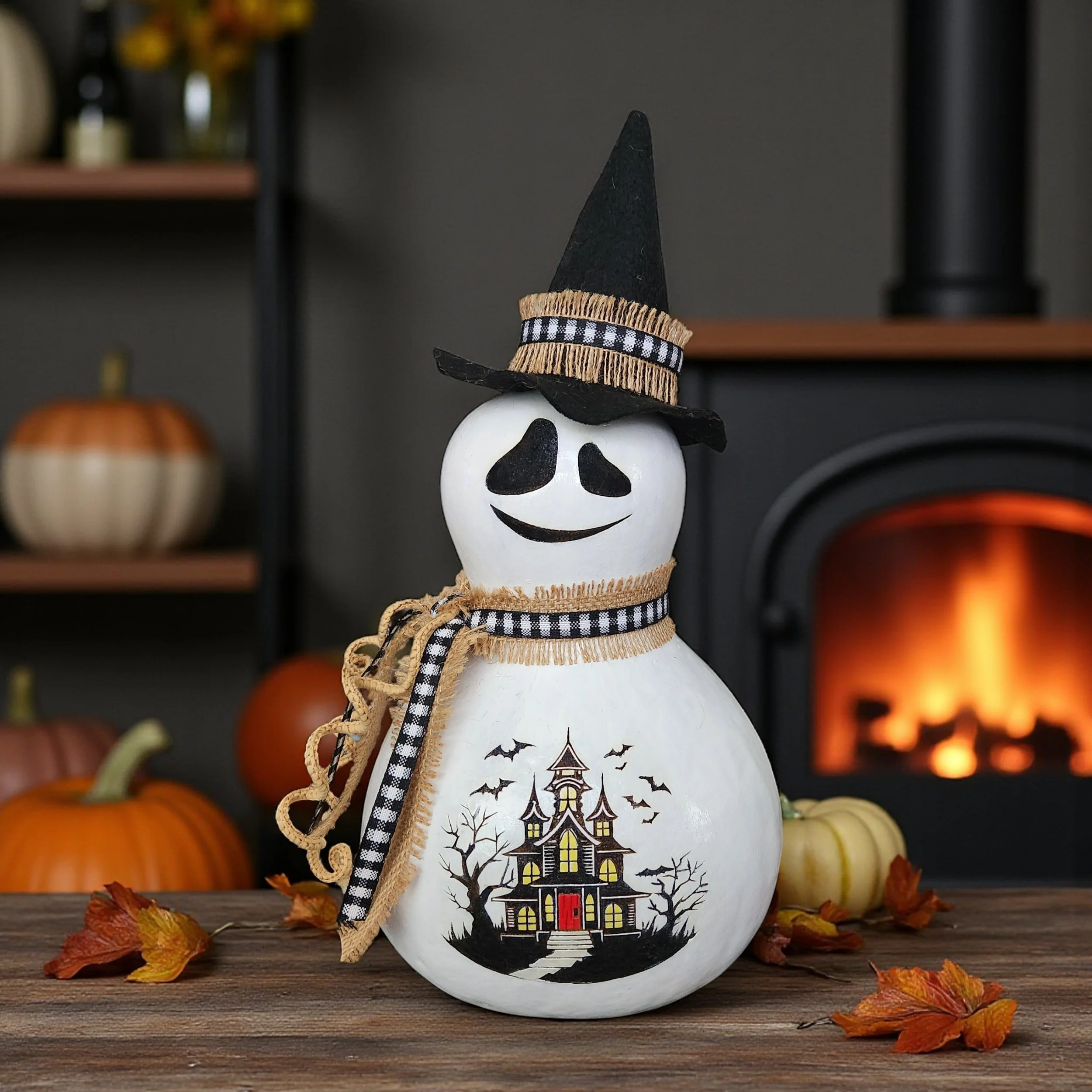 Ghost Witch Bottle gourd as centerpiece on festive table.