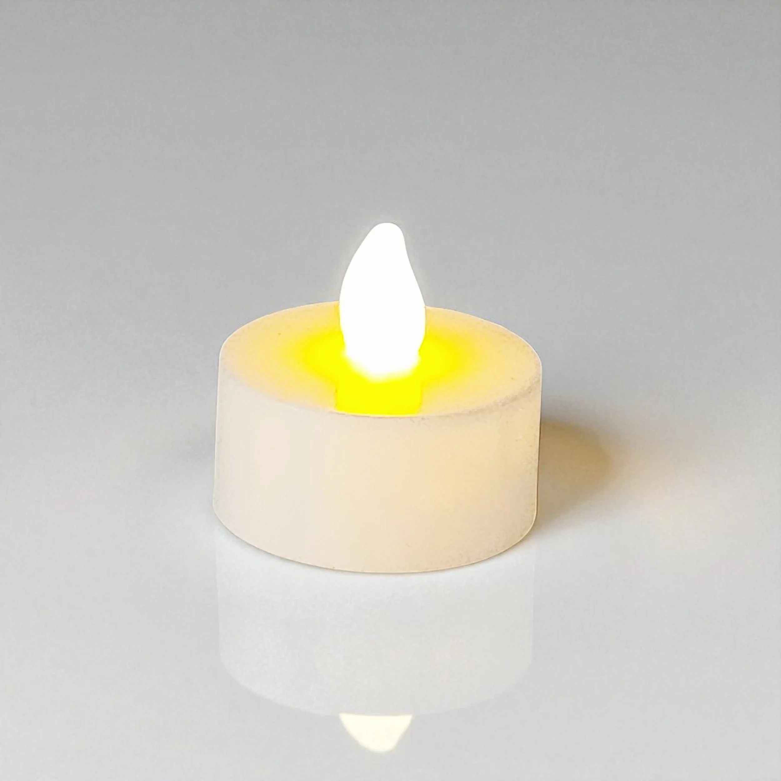 Flameless flickering Tea light to be used with gourd jack-o-lantern.