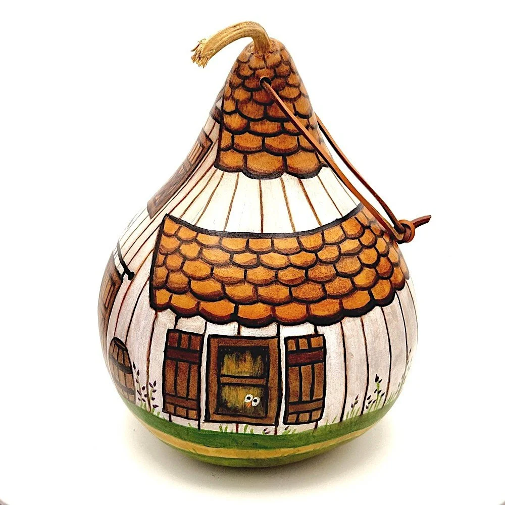 Side profile of the handcrafted White Barn Gourd Birdhouse, highlighting its curved shape and weather-resistant finish.