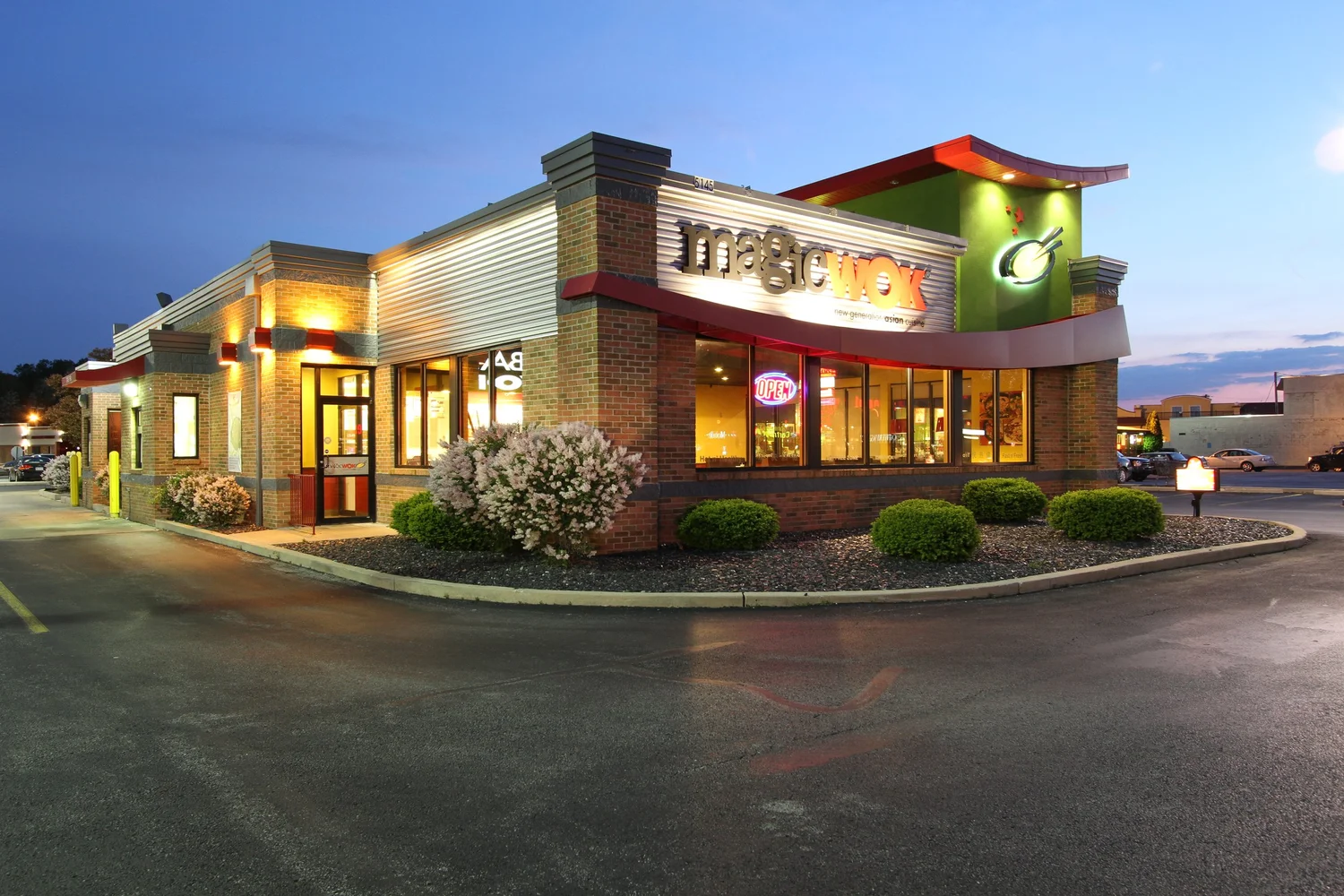 A Magic Wok restaurant at dusk