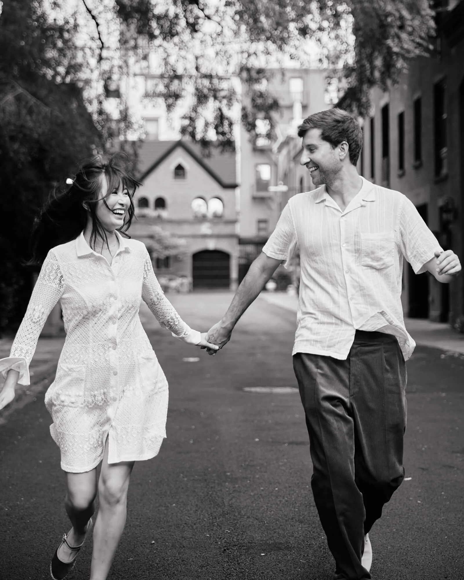 Candid moment of engaged couple having fun