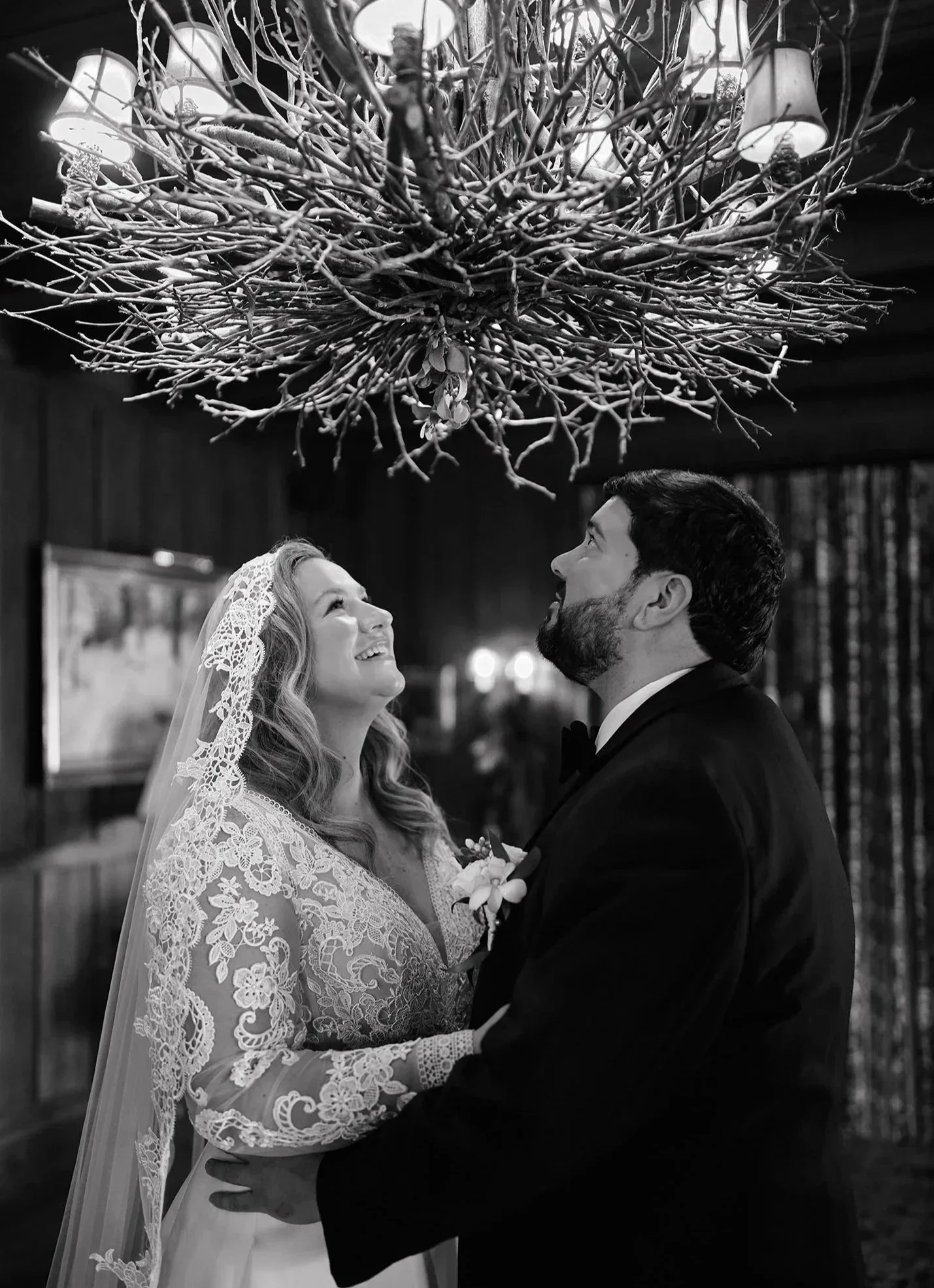 Bride and groom under the mistletoe