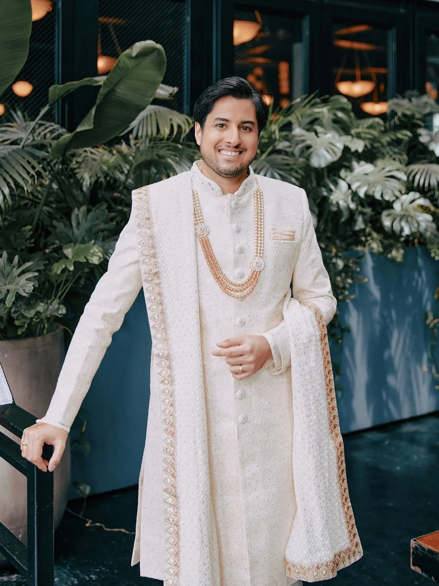 The elegant groom in his traditional white sherwani