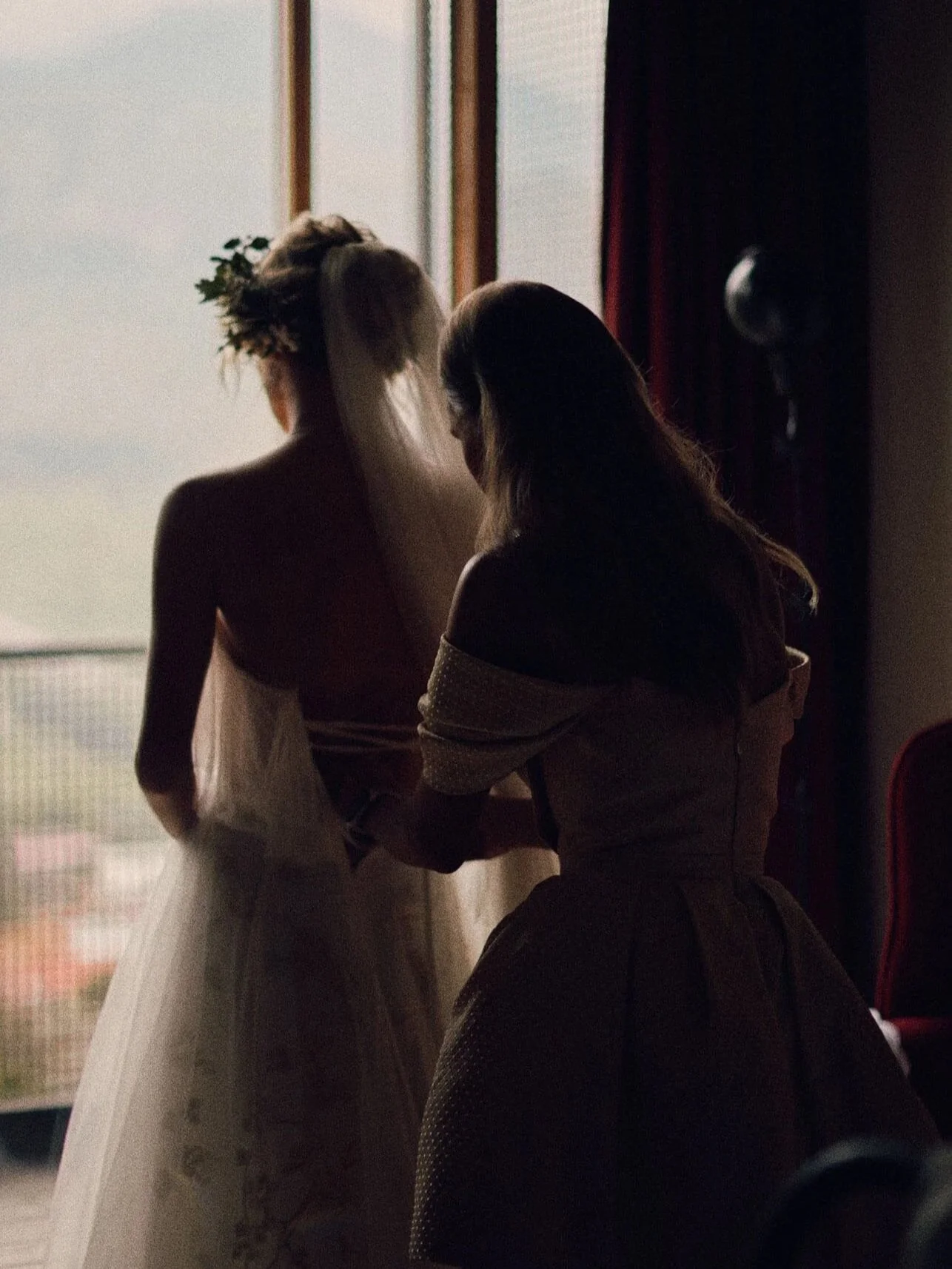 Bride getting ready by the window