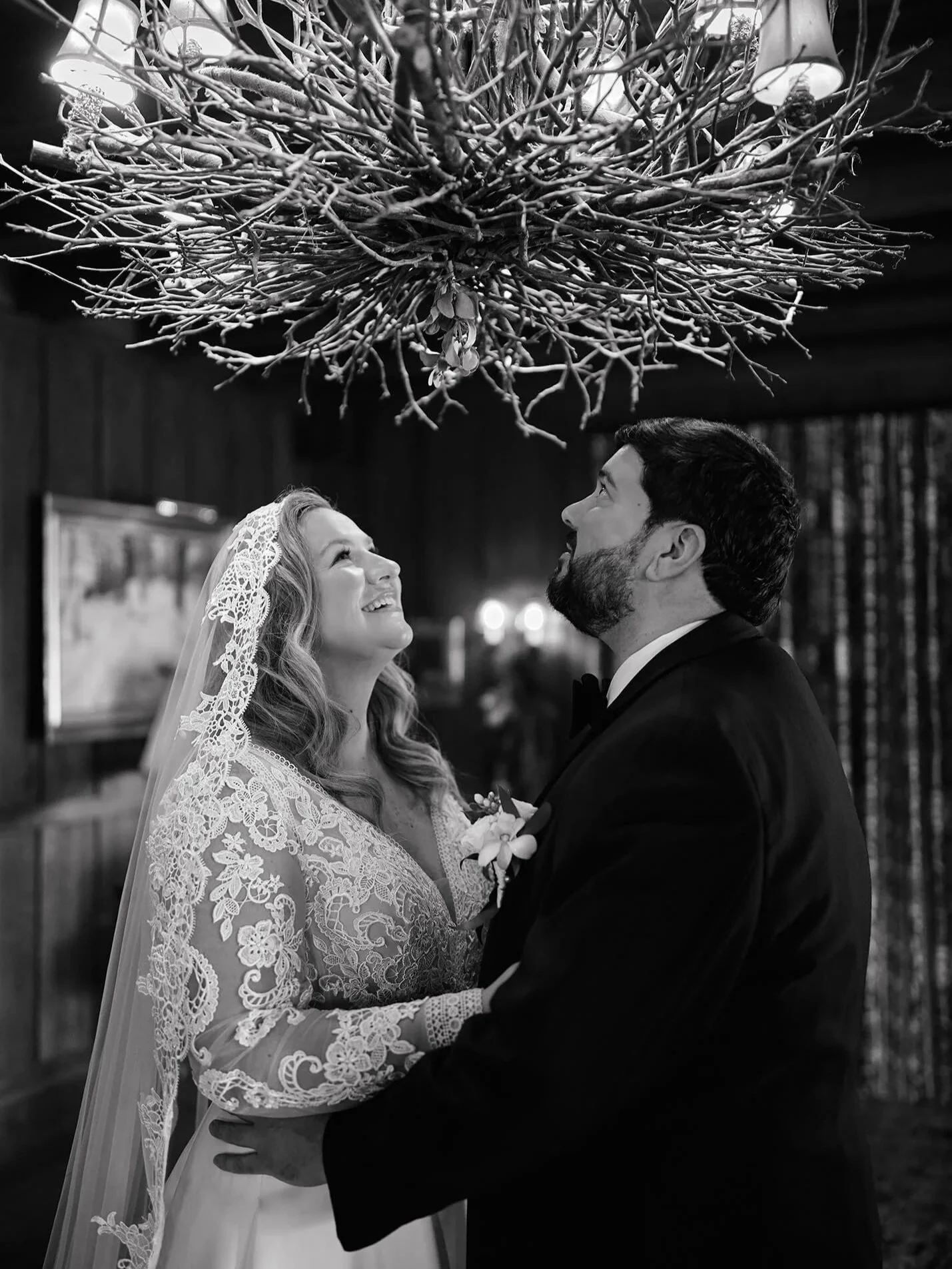 Bride and groom under the mistletoe