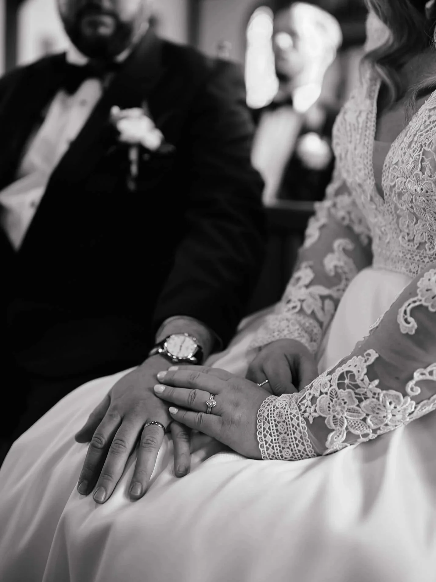 Close-up of couple’s hands at altar