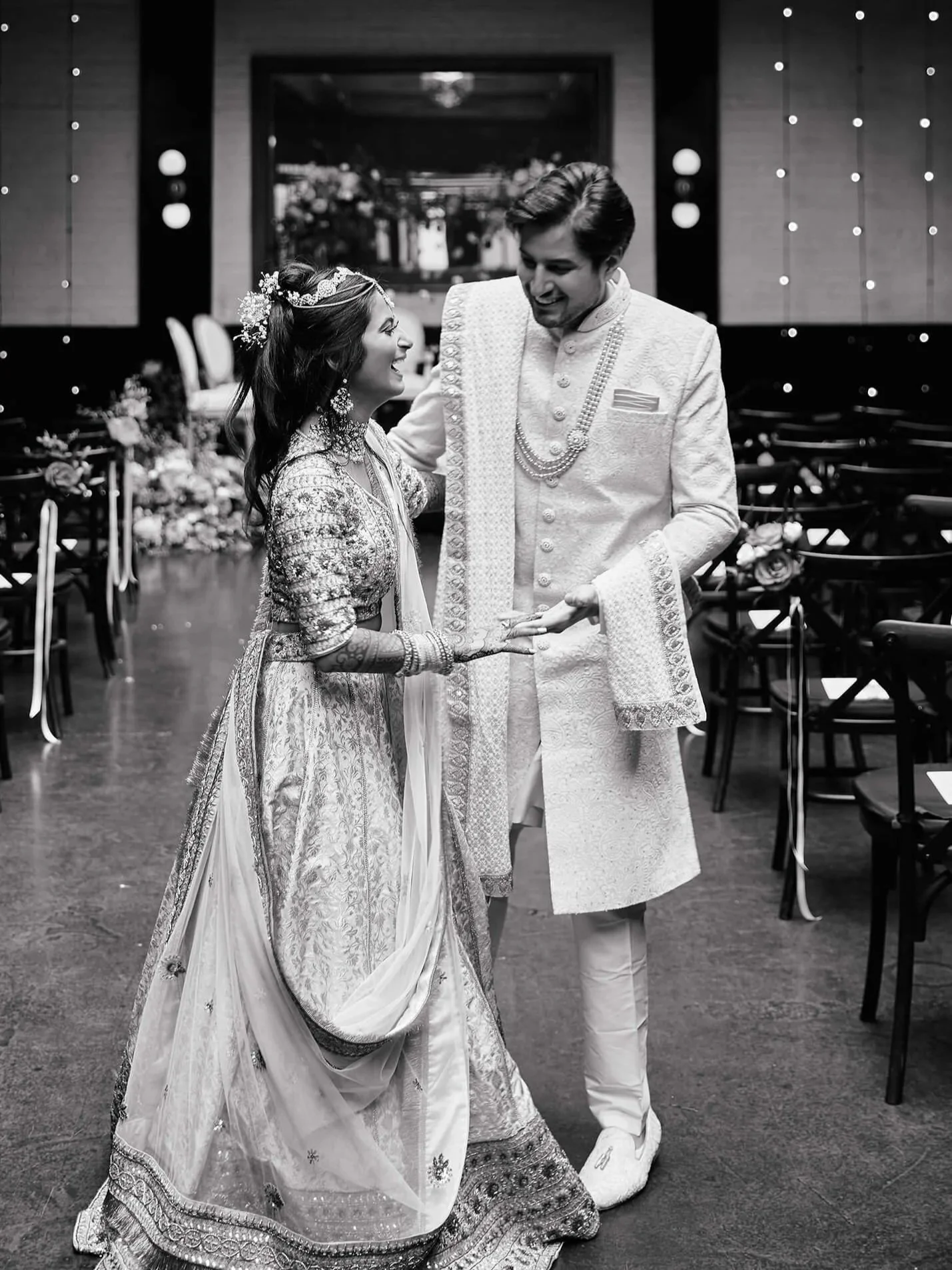 An intimate black and white moment of the couple sharing a laugh