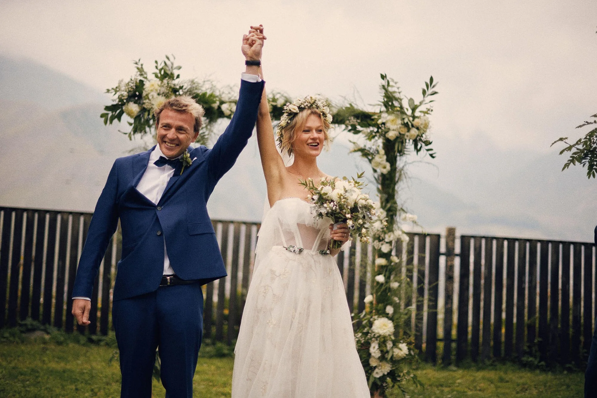 Hands raised in celebration after ceremony