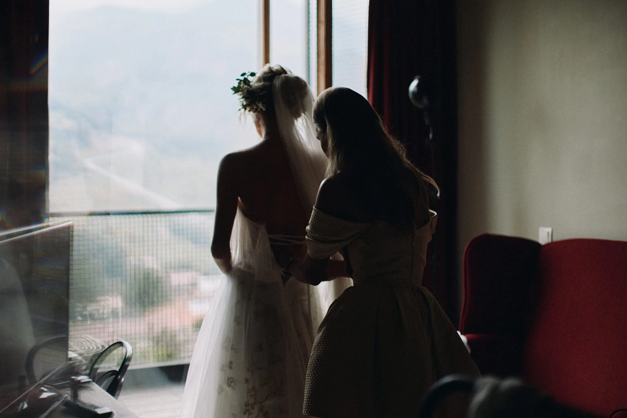 Bride getting ready by the window