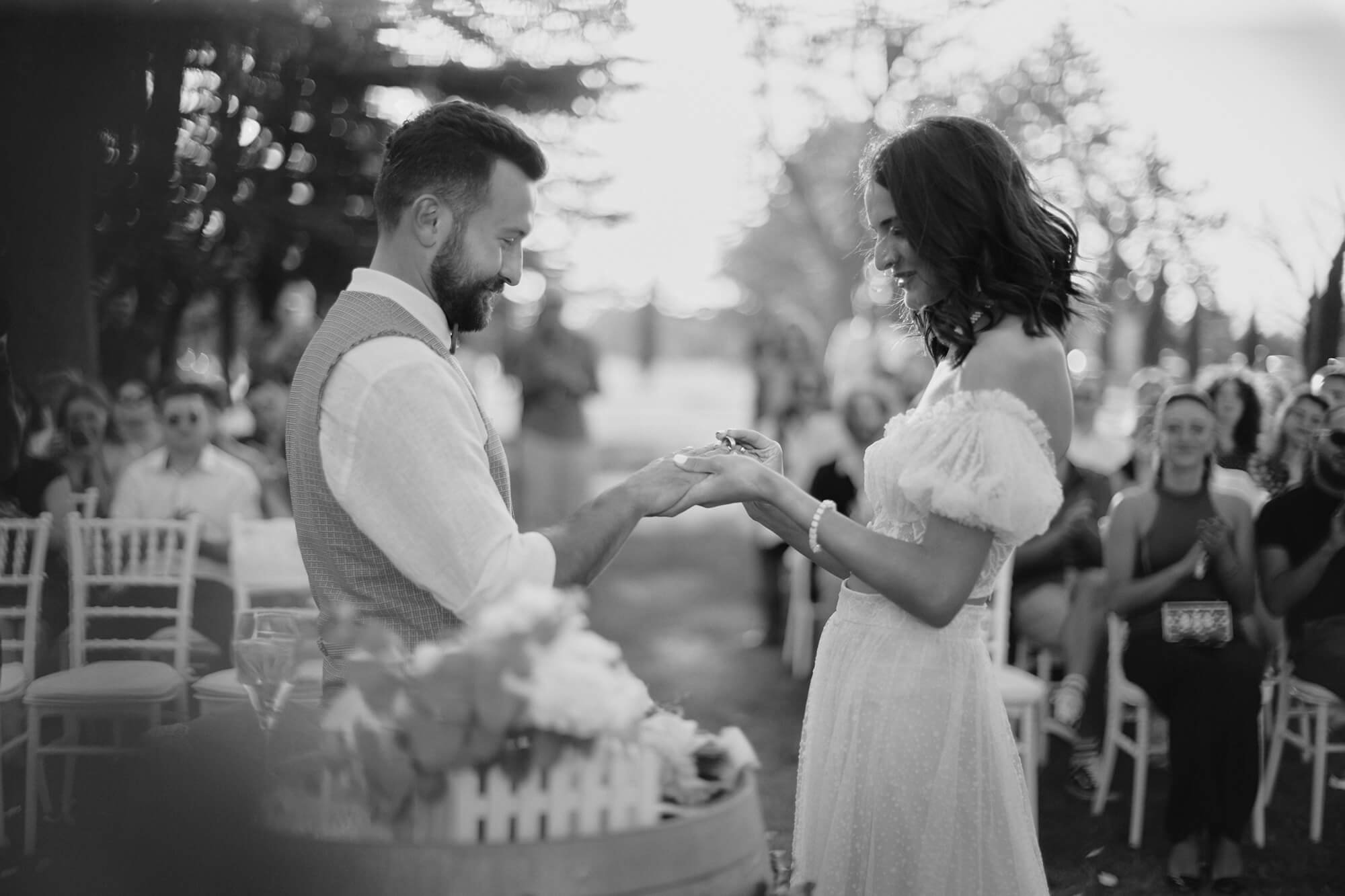 Bride and groom in a black and white ring moment