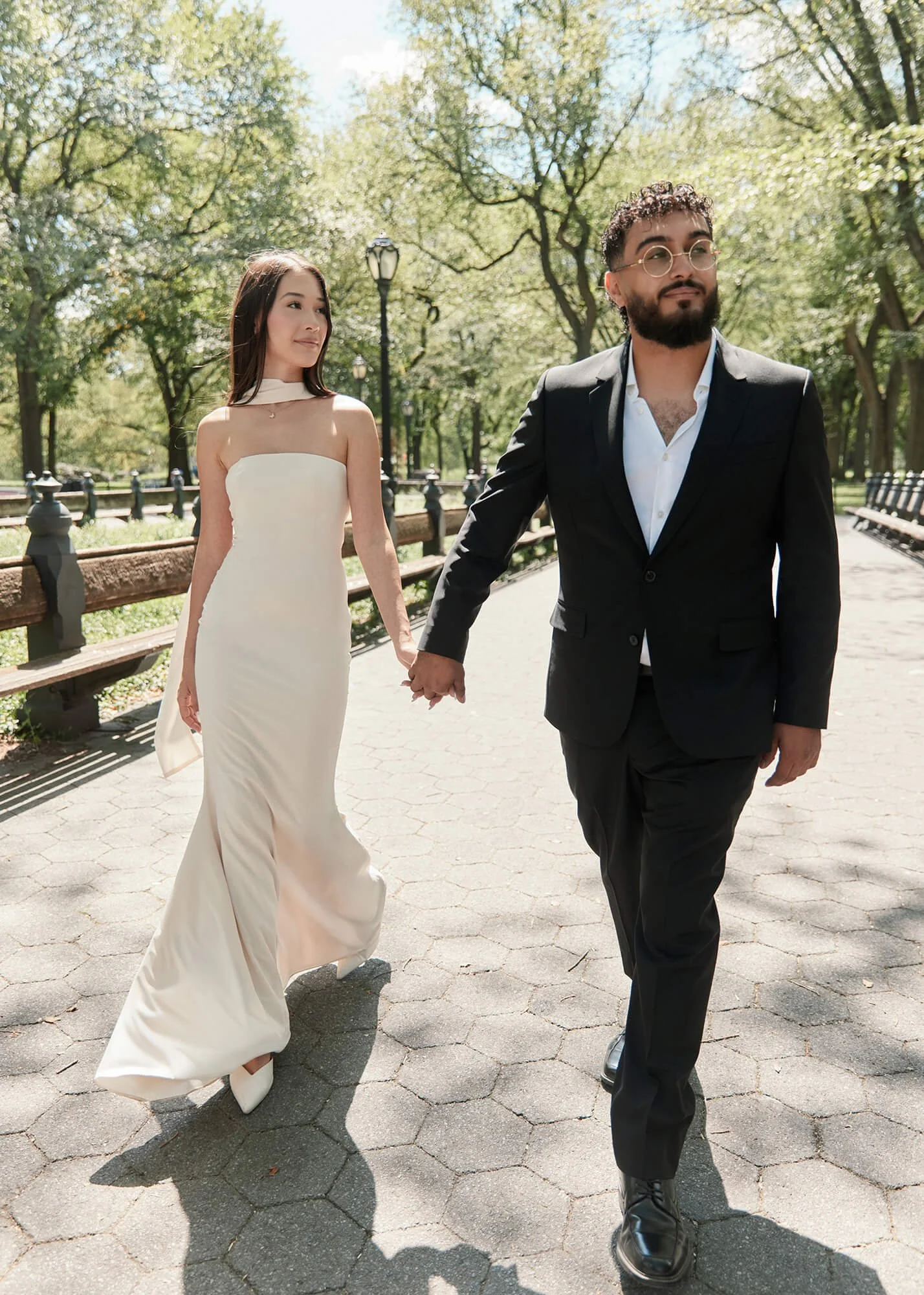 Engaged couple walking together in Central Park during their NYC engagement session