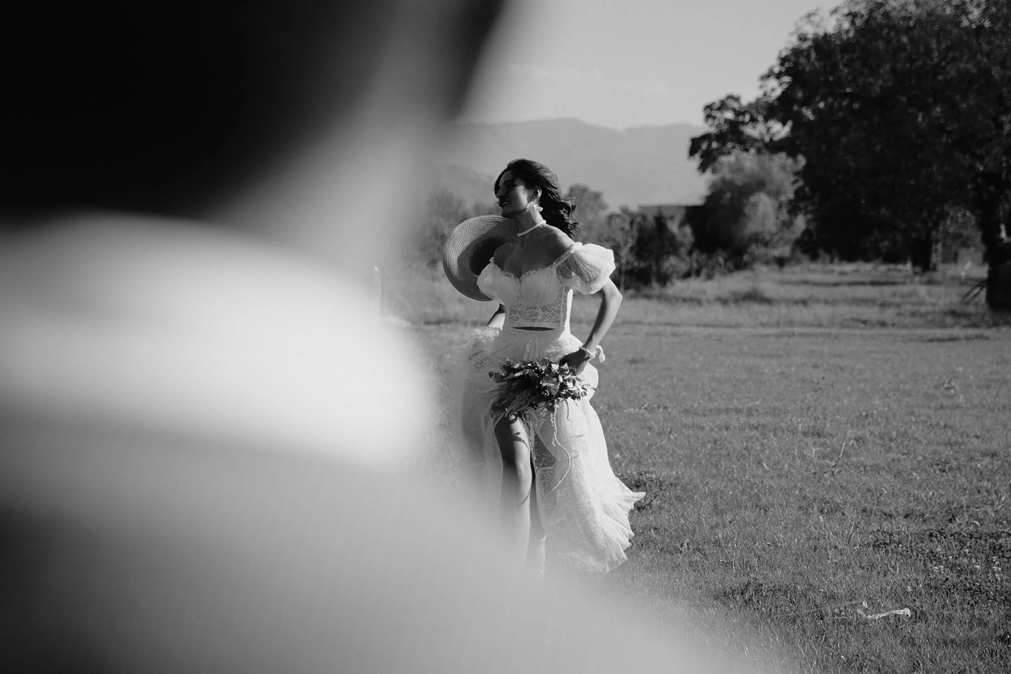 Joyful bride running toward groom, candid moment