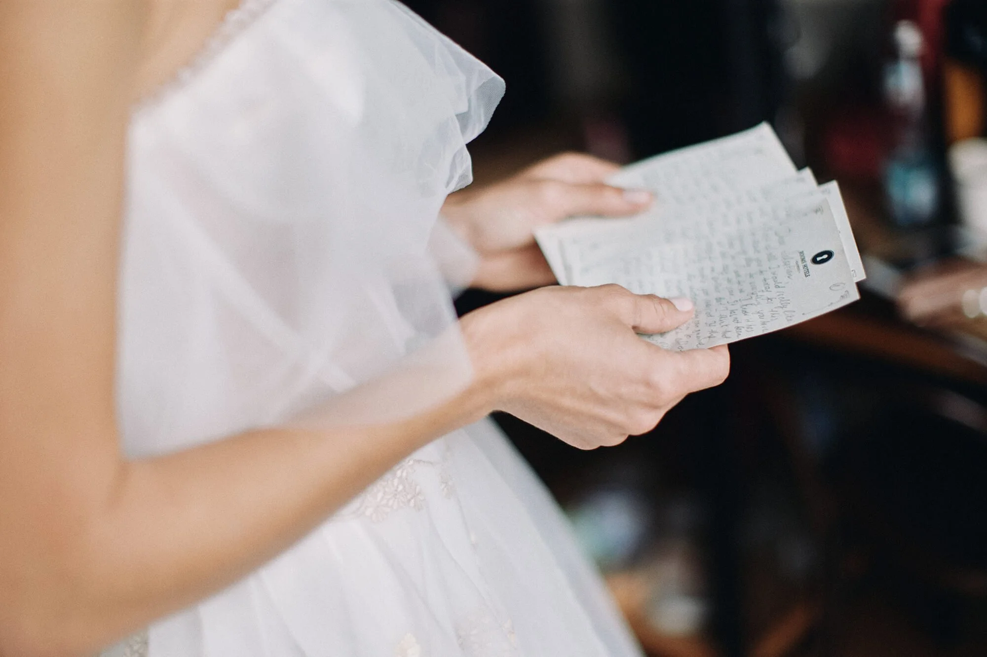 Bride reading a letter with emotion