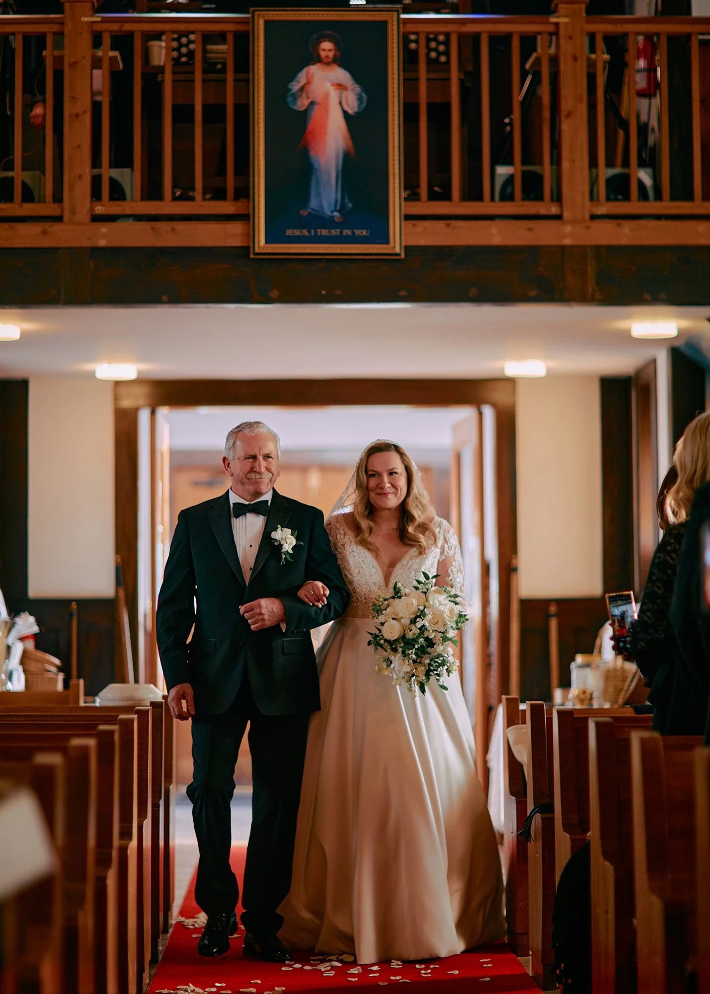 Bride walking into church with her father, emotional moment