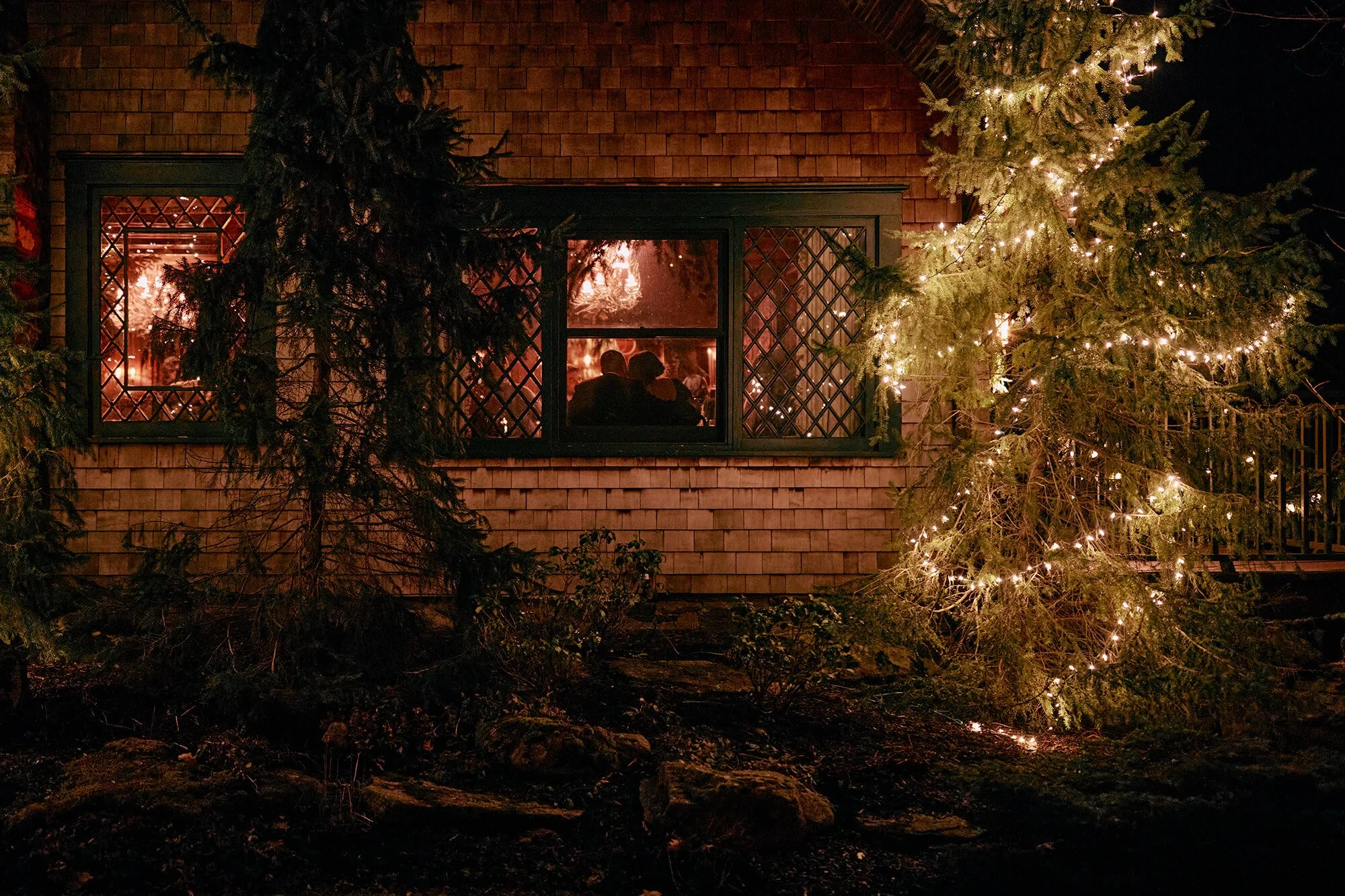 Warm nighttime venue shot with glowing lights and fireplace