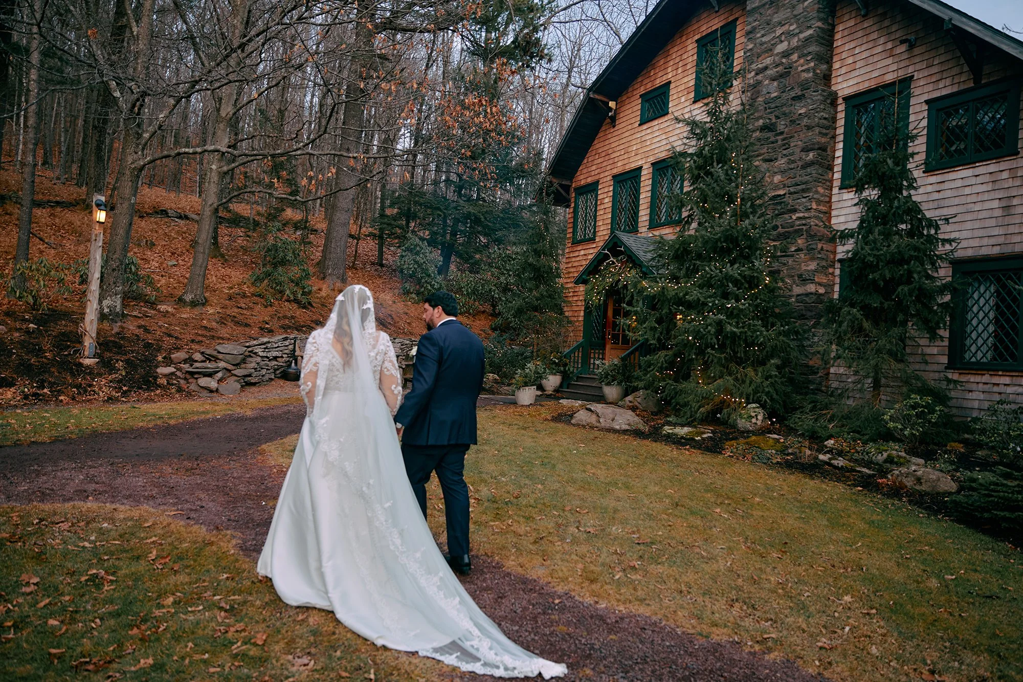Bride and groom walking outside venue