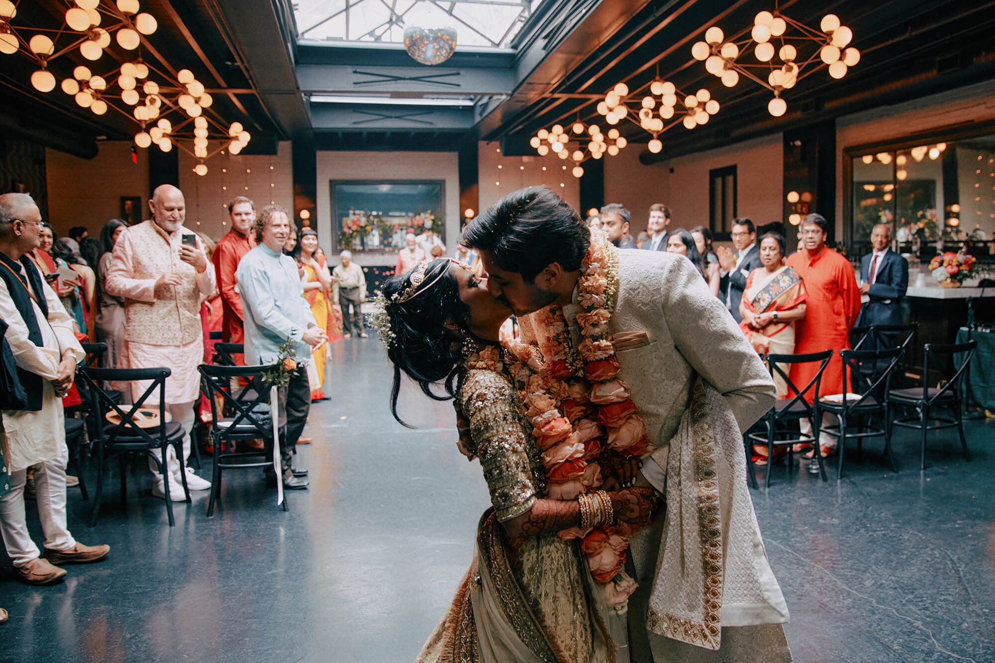 A romantic, candid moment of the bride and groom at their Indian fusion wedding reception