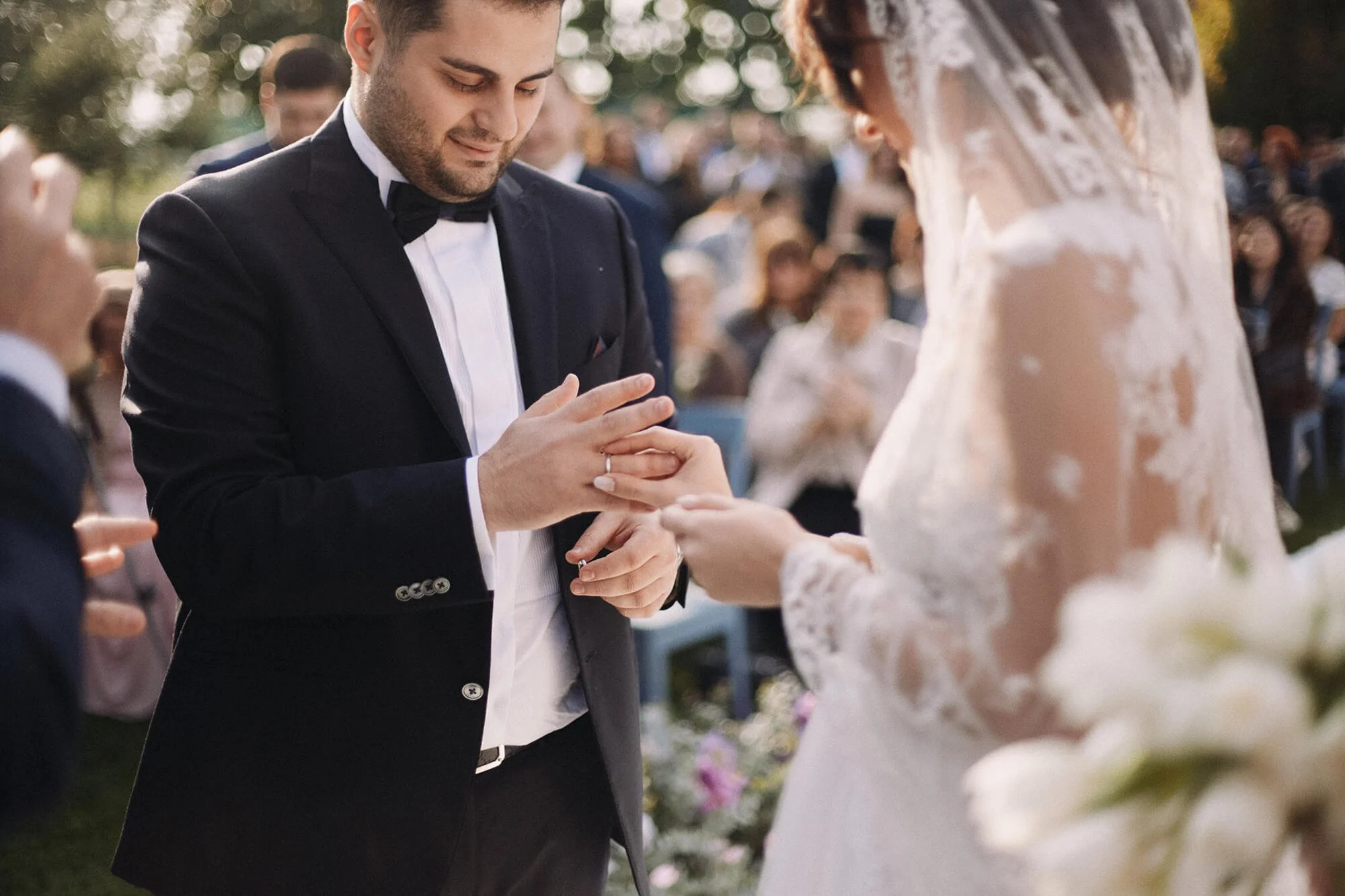 Wedding moment: couple putting on rings