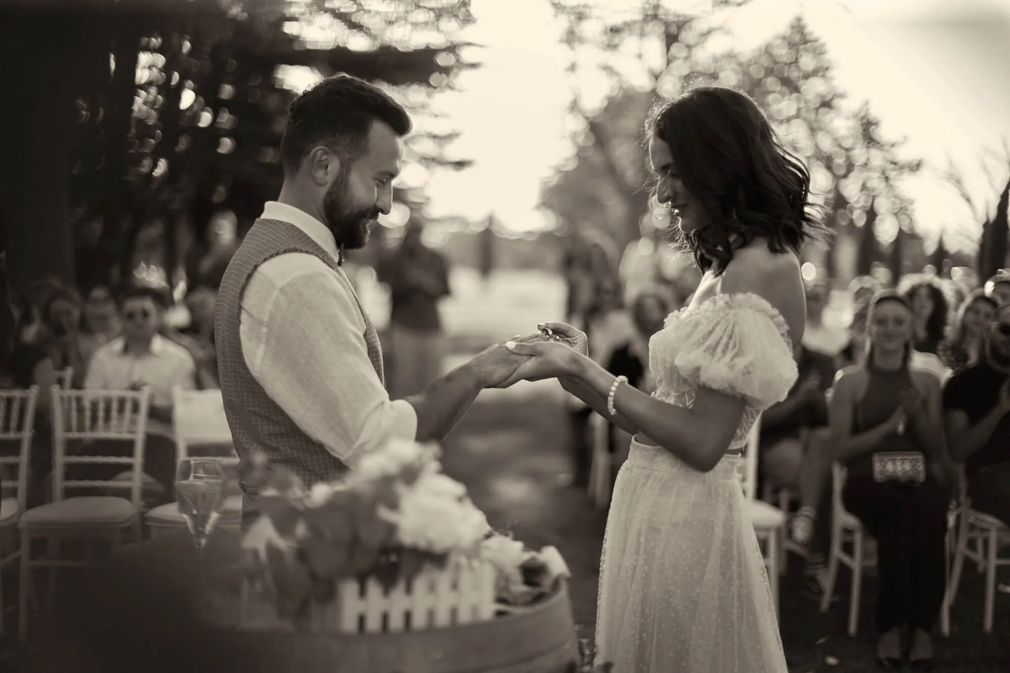 Bride and groom in a black and white ring moment