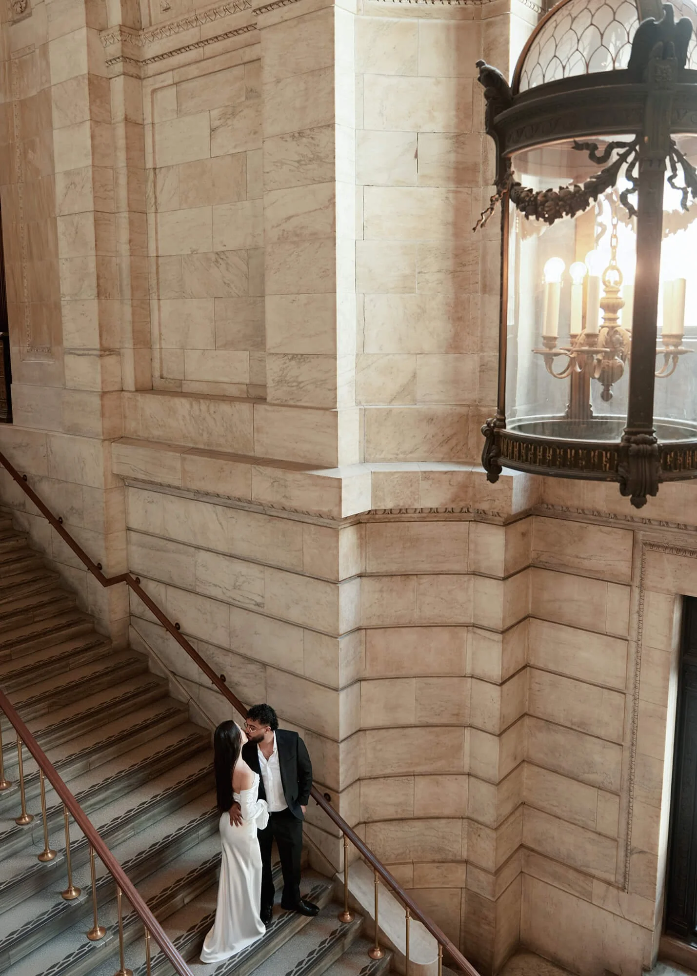 Romantic engagement portrait of couple on New York Public Library steps