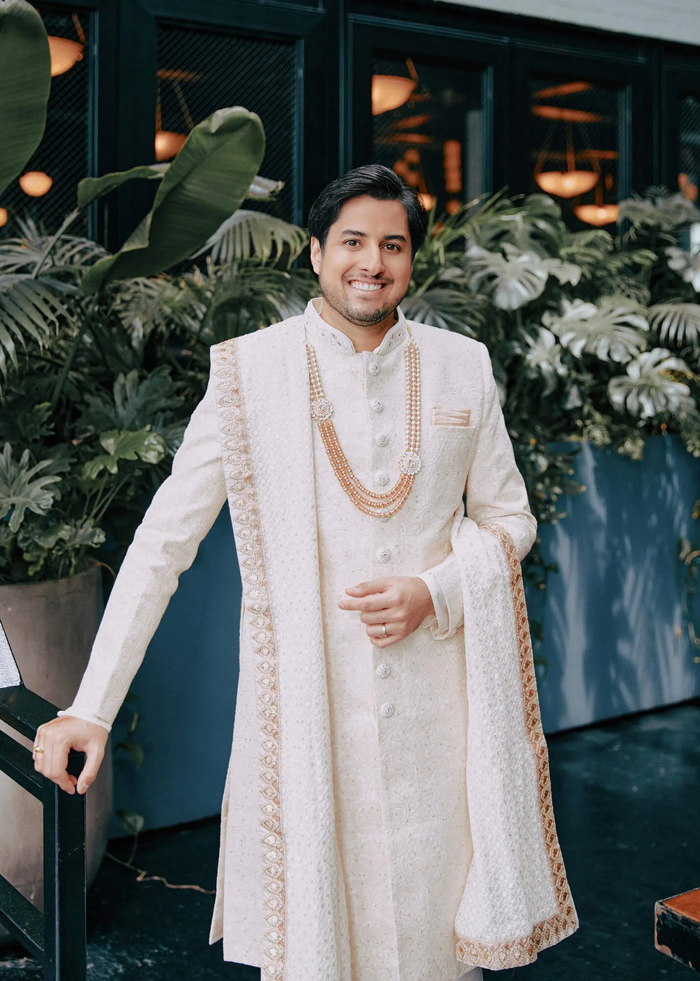 The elegant groom in his traditional white sherwani
